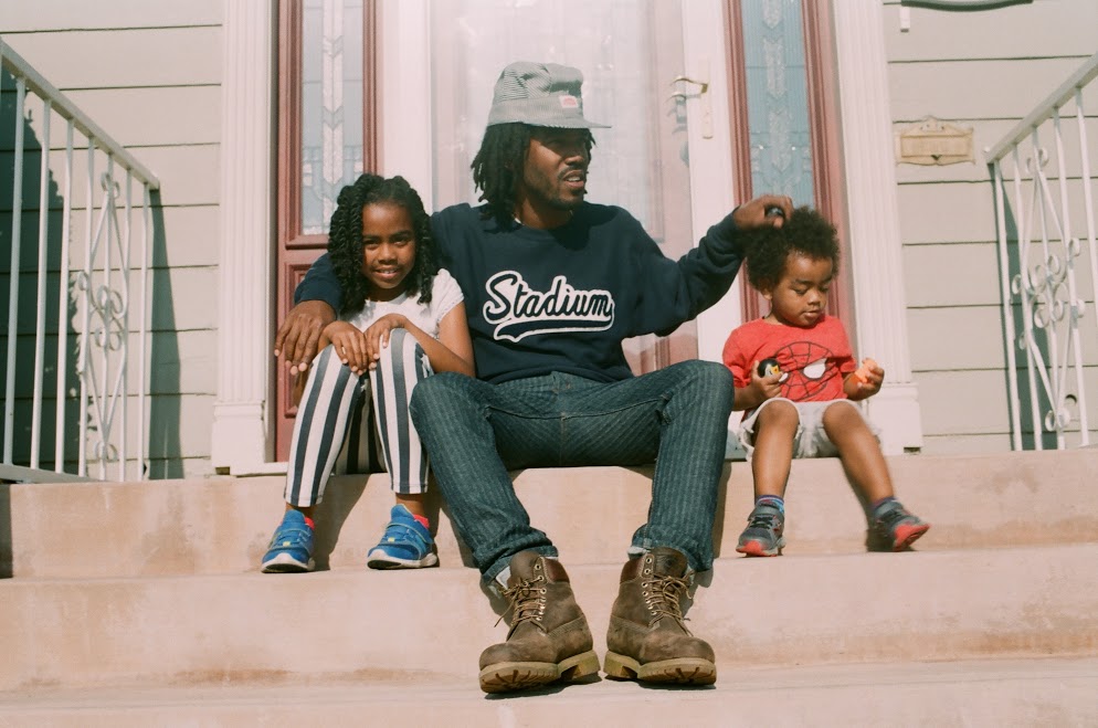 Yanai, Thurz, and Kingston in front of their home in Inglewood, CA