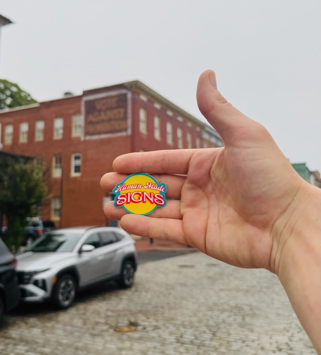 yellow:teal sticker hand 2.jpeg