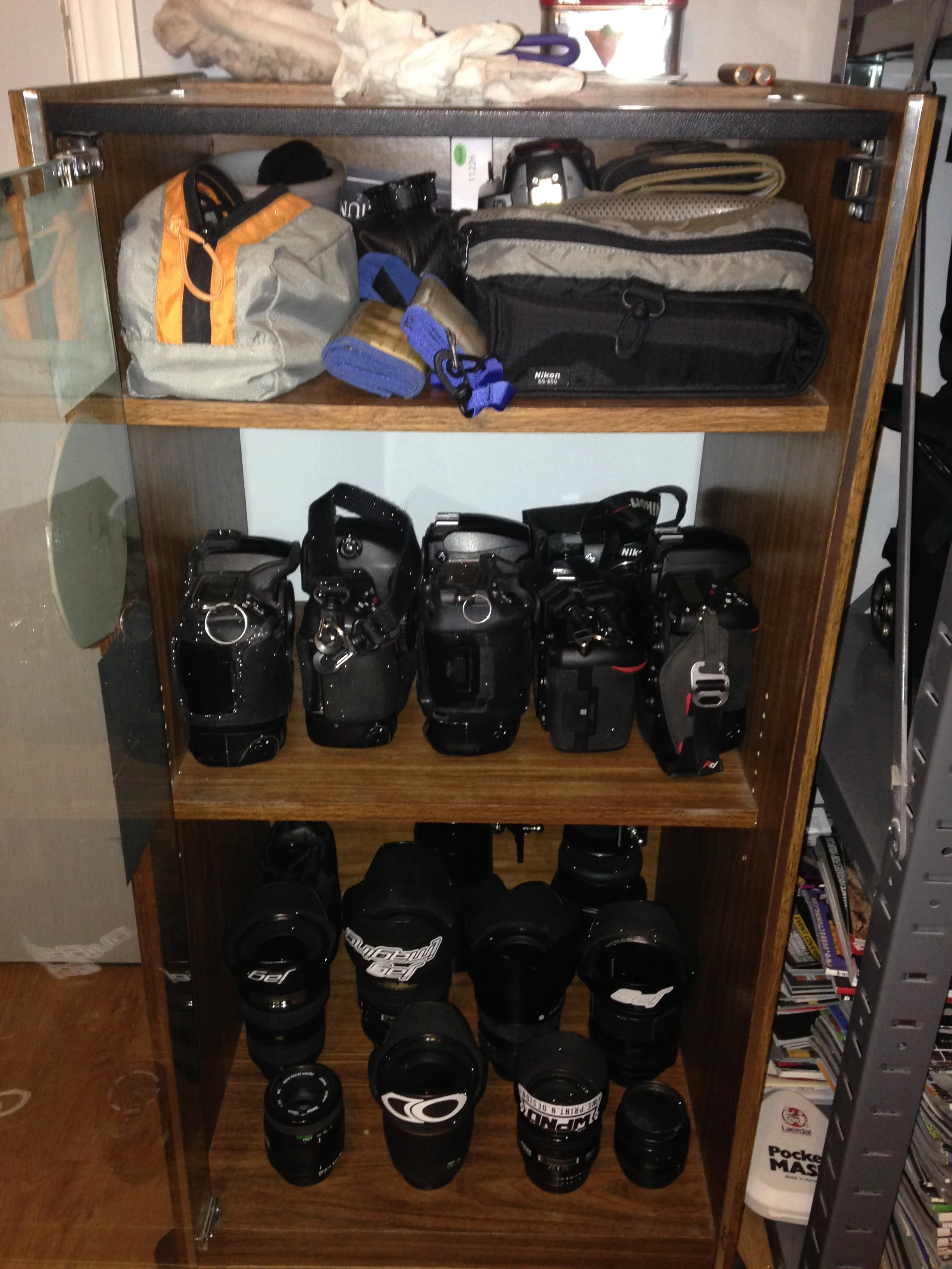 Next up was the organize my gear section. For ever my camera gear lived in my Think Tank AirPort Security V1 . It was great but with adding gear I ran out of room and my bag would never really get used since it was serving as gear storage. So I cleaned out one of my old cabinets that had been storing all my random camera stuff and set it up for my proper photo gear. First shelve is all my off camera flash's as well as my memory card wallets and spare batteries. Second shelve is all my still working DSLR's and my Old Nikon F80. Last shelve is all my lens. Now all my main gear will stay in its new home and will be easy to access when I have a shoot. 