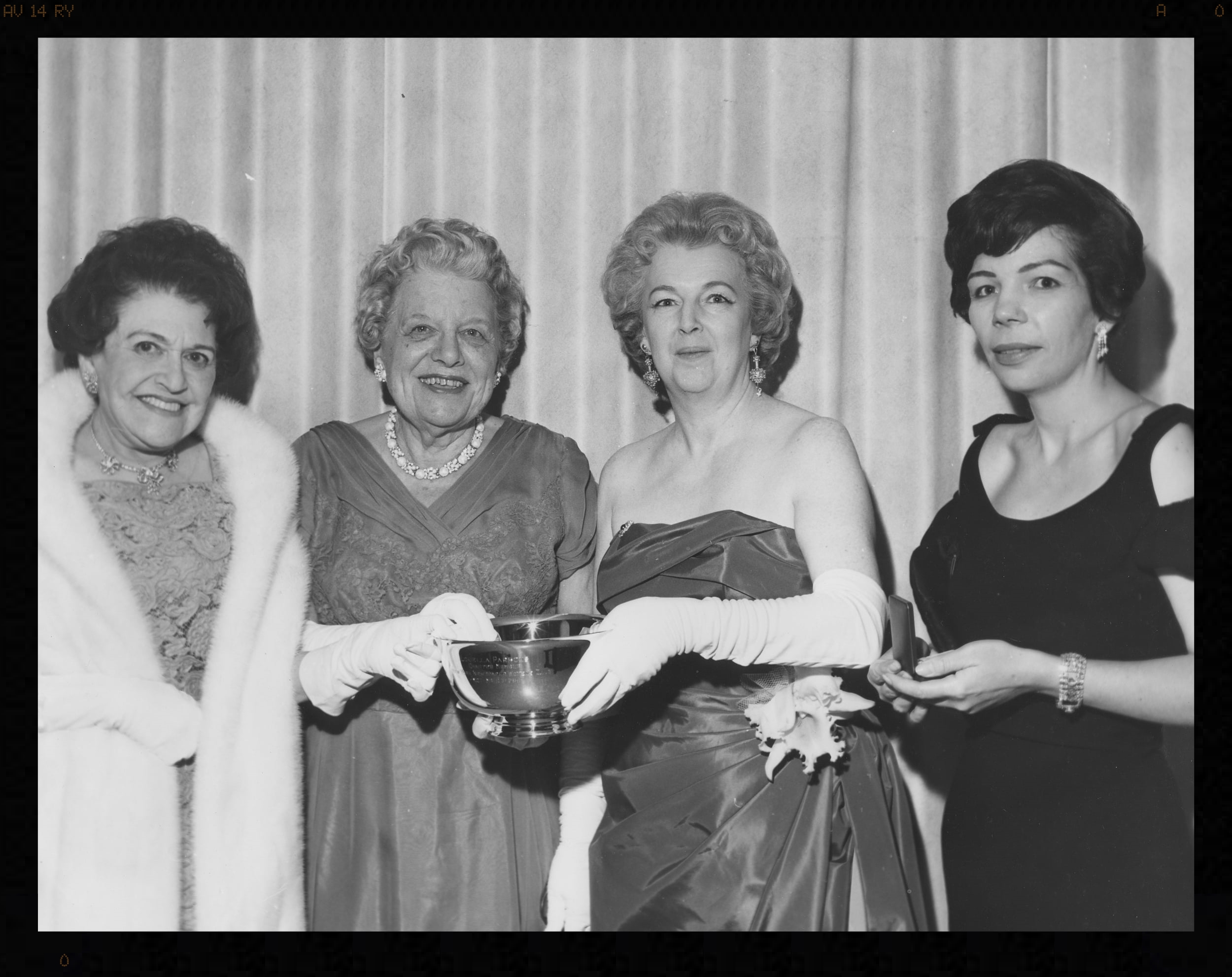 Louella Parsons, Emma Bugbee, Kay Lawrence and Christina Kirk at a ceremony honoring Bugbee’s career at the New York Herald Tribune. Bugbee’s coverage of world events began with the sinking of the Titanic and continued through the 1960s. Lawrence was president of the Newswomen’s Club in 1960 and 1961. Kirk was the club’s president in 1963.