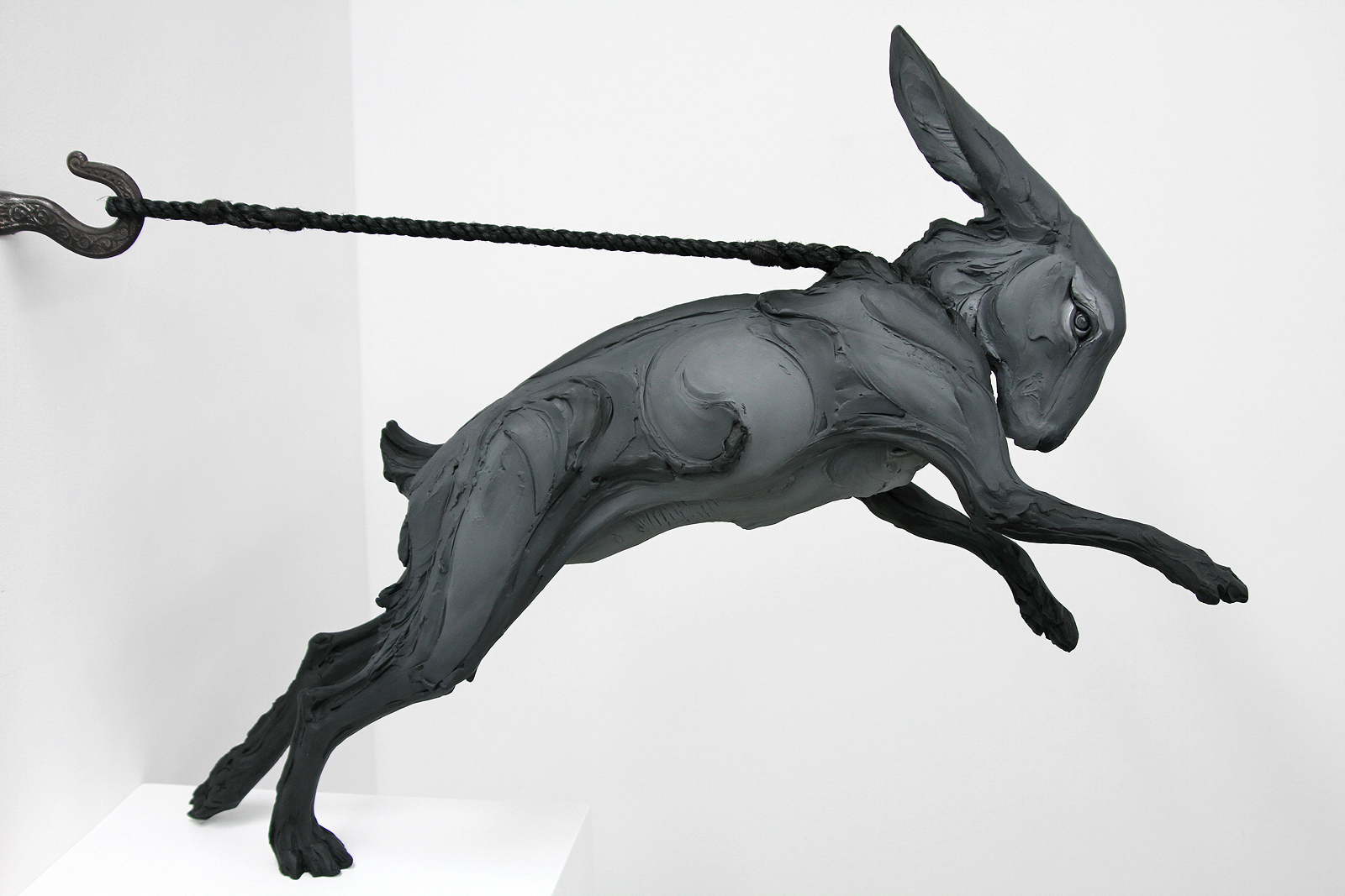 Beth Cavener, Kept (Variation in Shadow), 2016. Resin infused refractory material, paint, rope, wooden base. Jason-Jacques Gallery.