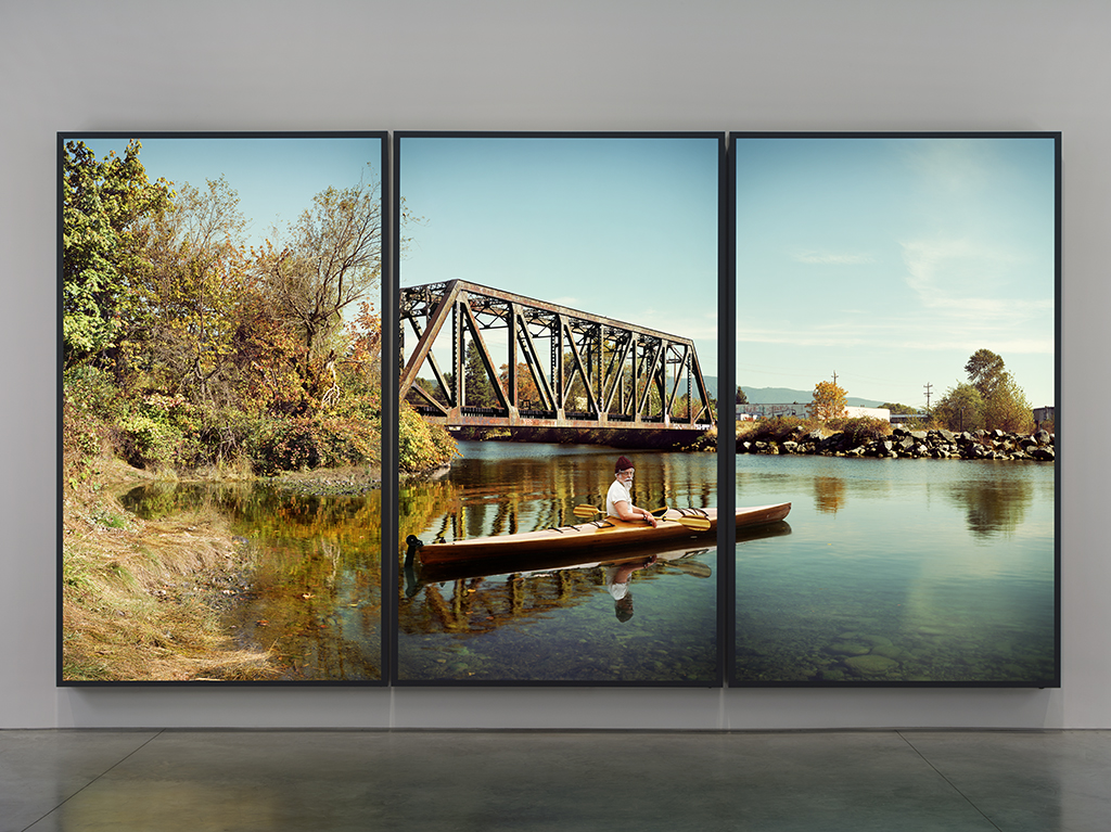 Rodney Graham, Paddler at the Mouth of the Seymour (2012-2013) three aluminum lightboxes with transmounted chromogenic transparencies Collection of the Vancouver Art Gallery. 