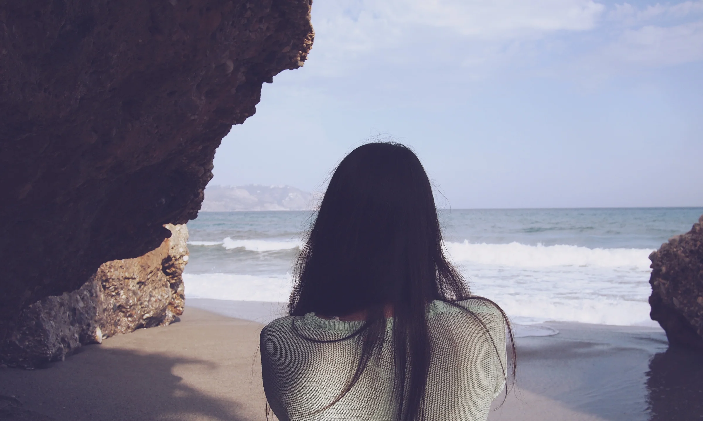 woman looking at ocean beach.jpeg