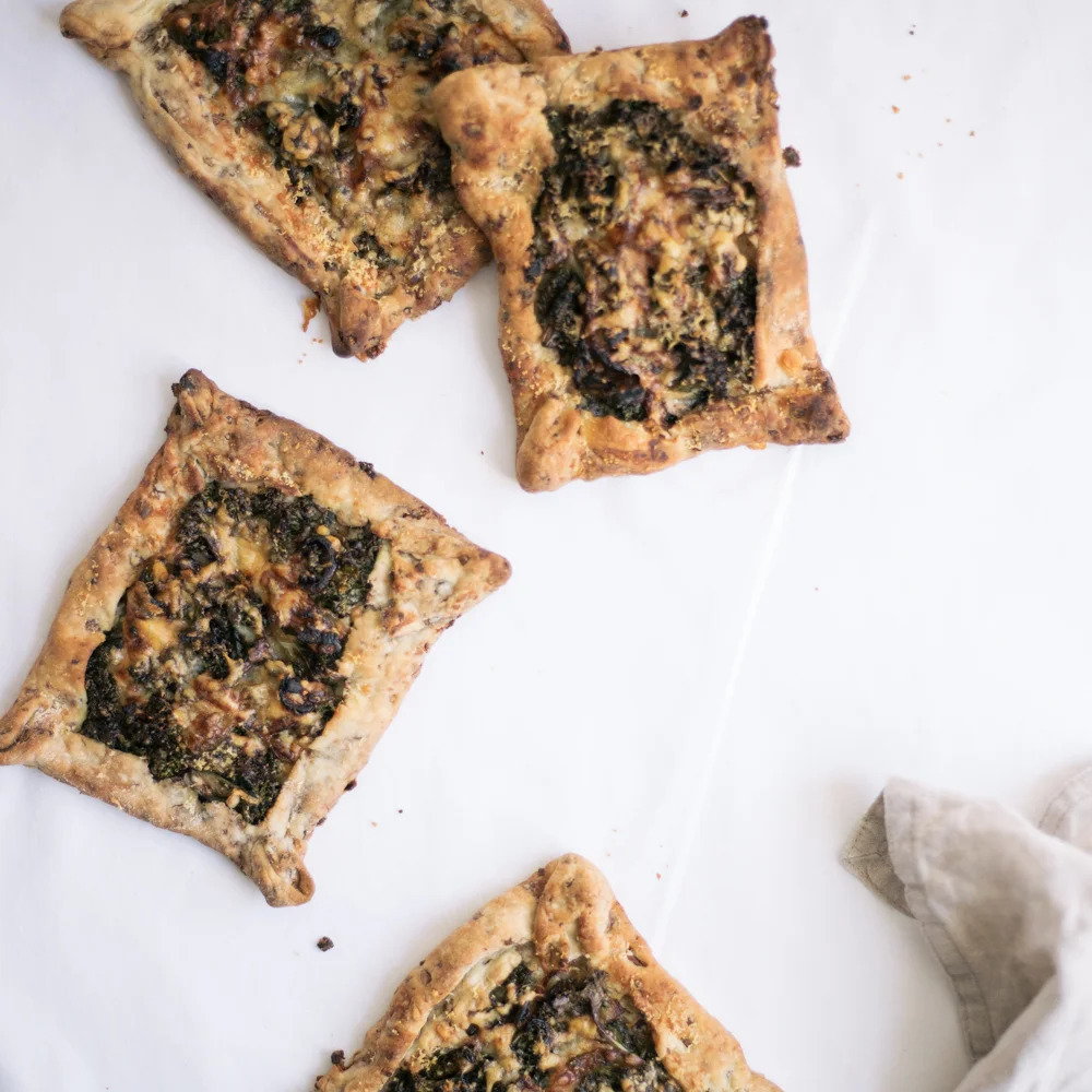 KALE, CARAMELISED ONION & CHEESE TART WITH A CHESTNUT PASTRY