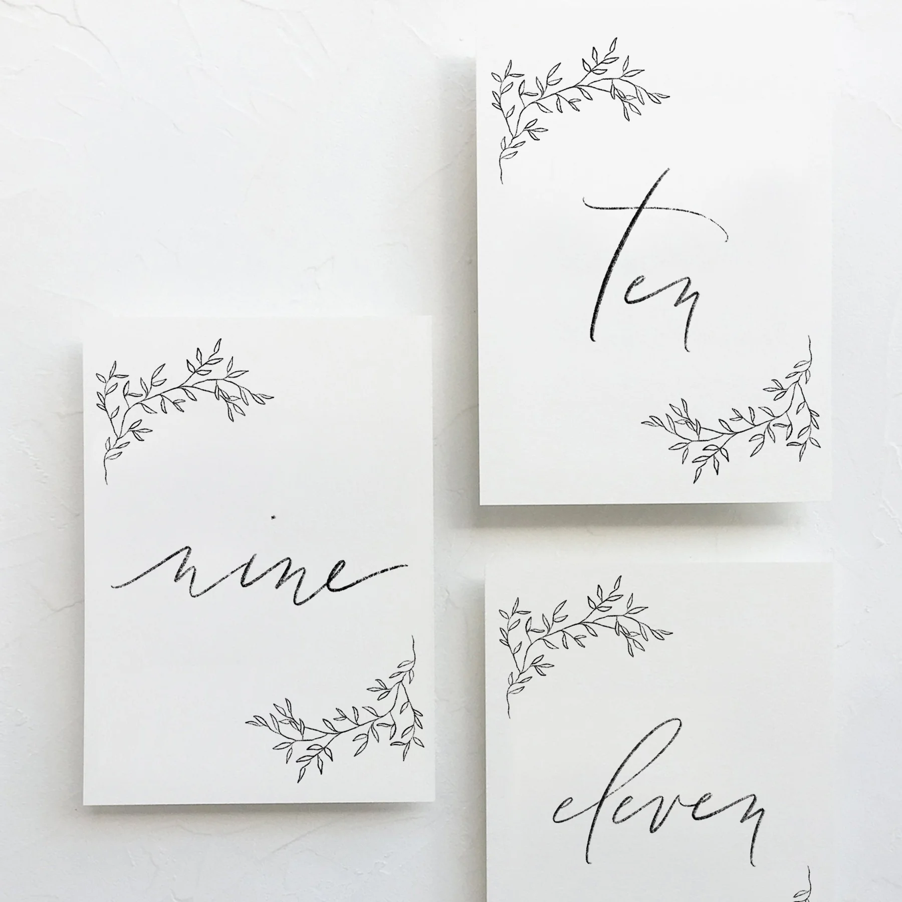 modern-calligraphy-pencil-graphite-charcoal-wedding-table-numbers-decor-botanical-wreath-tupelo-6.jpg