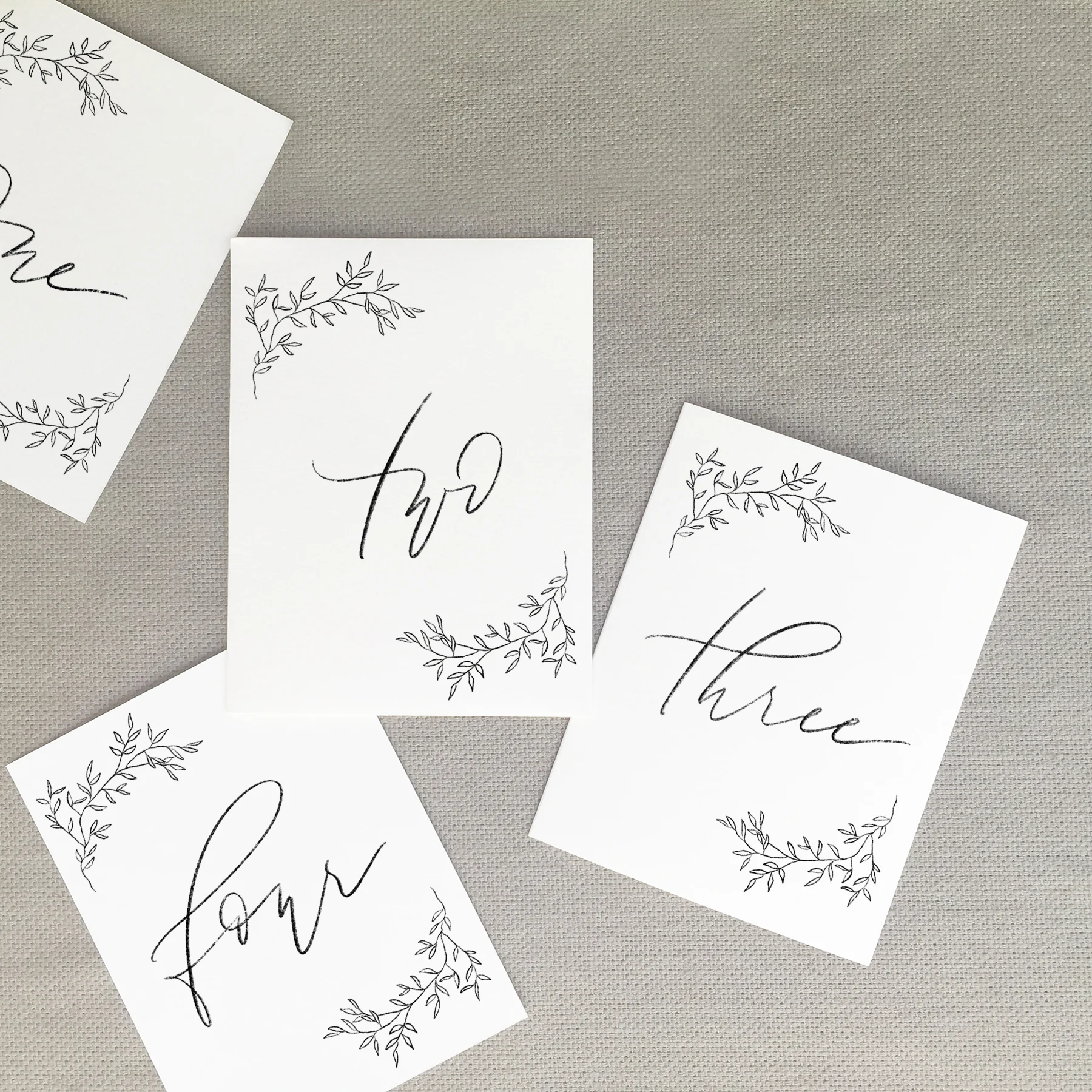 modern-calligraphy-pencil-graphite-charcoal-wedding-table-numbers-decor-botanical-wreath-tupelo-7.jpg