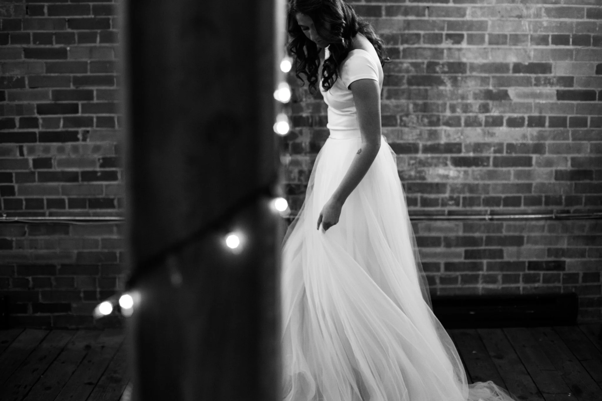 black and white bridal portrait of custom swishy skirt by Sinuous by Emily in Monigrams Coffee Roasters.jpg