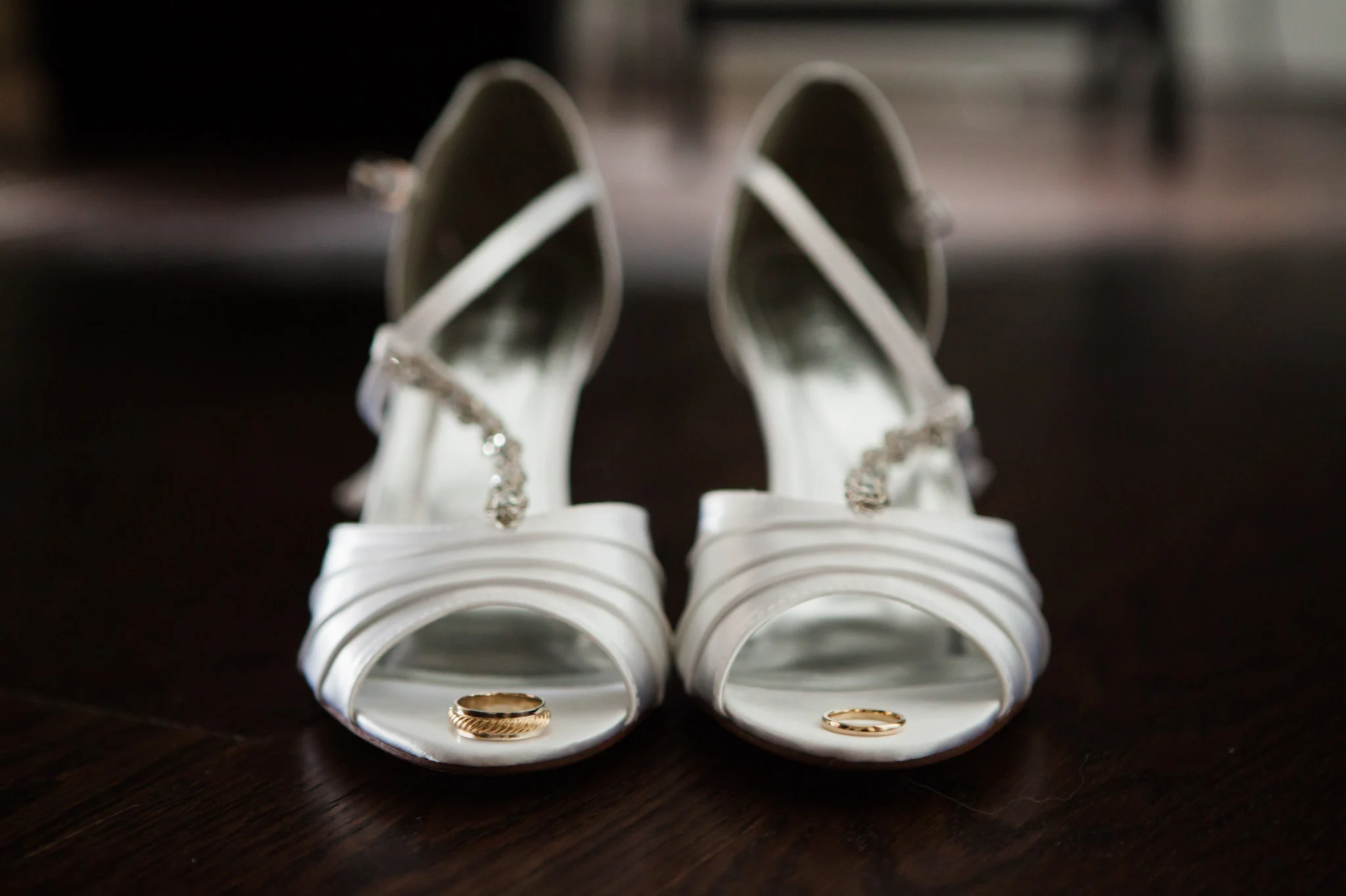 gold wedding rings in white wedding heels_.jpg