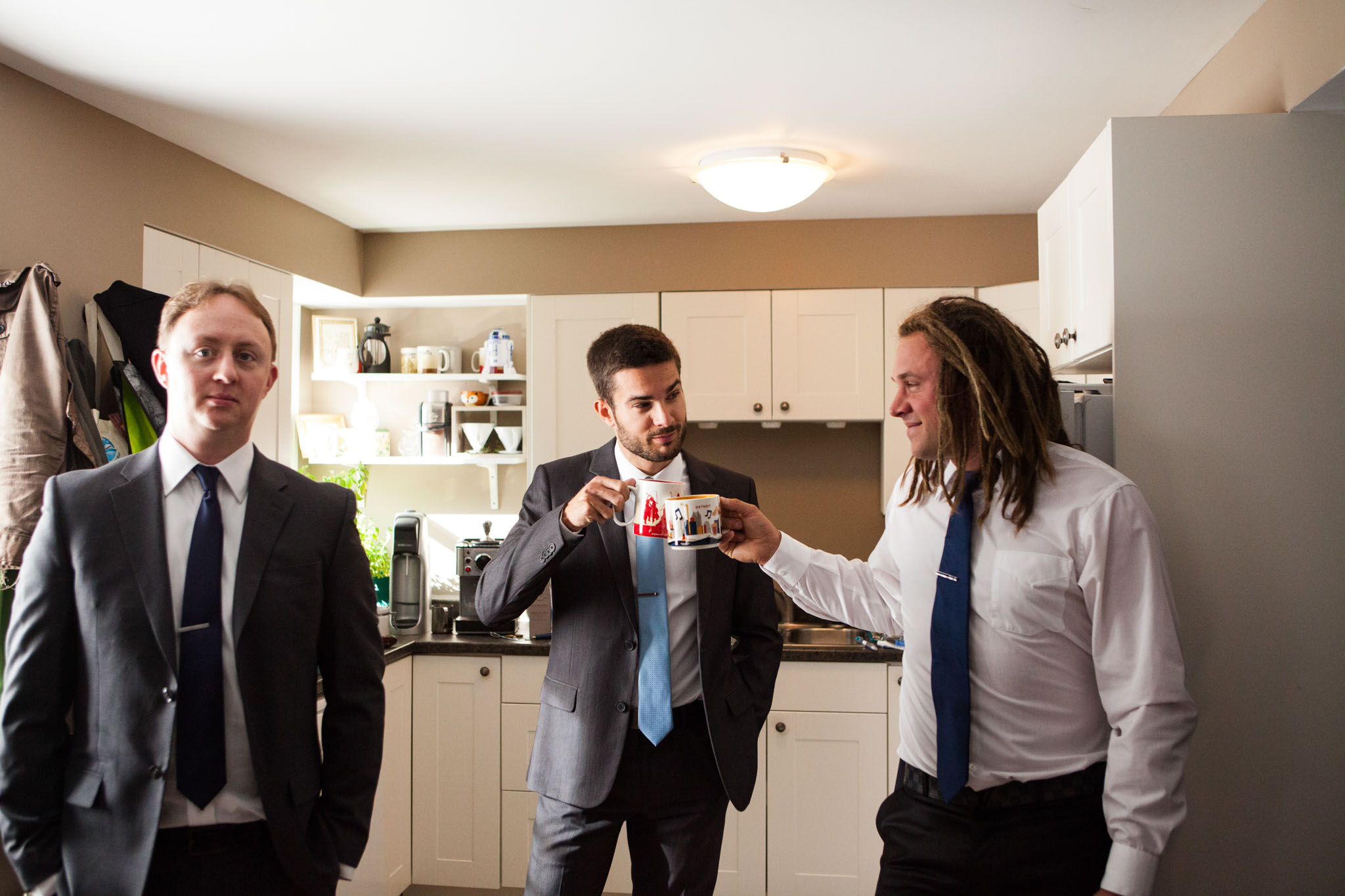 groomsmen enjoying freshly made americanos while getting ready for wedding.jpg