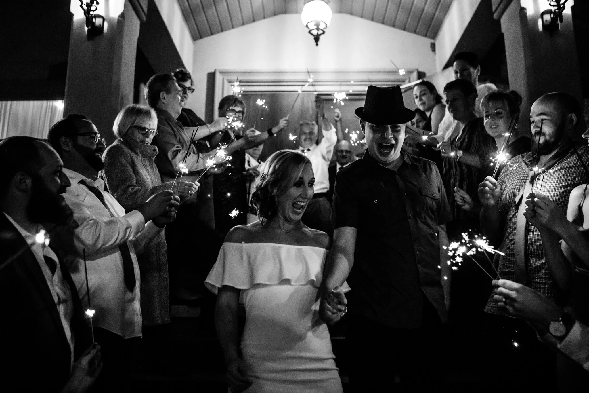 candid black and white sparkler send off on Polski Dom front entrance wedding photography.jpg
