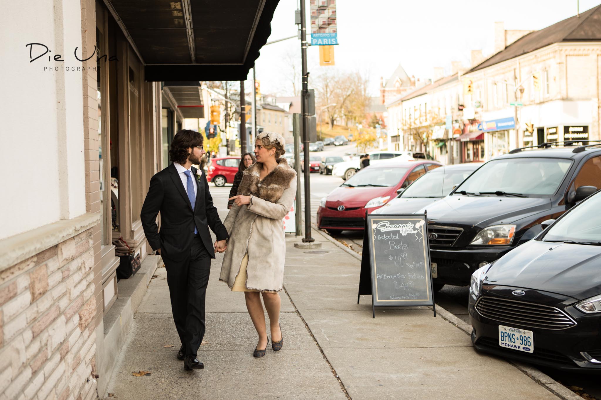  Bride and groom walking downtown Paris, Ontario. 