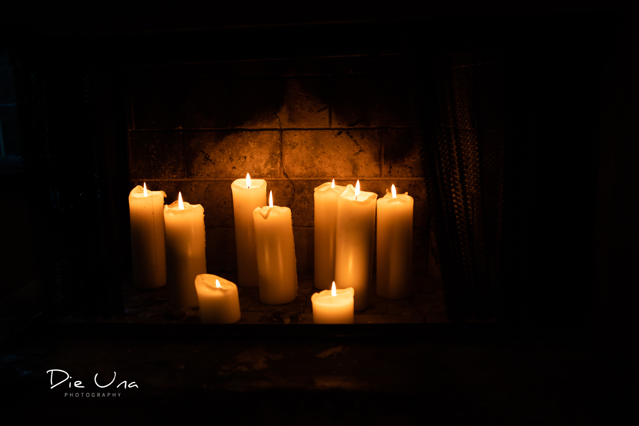 beautiful fireplace filled with lit candles in private room at the Auberge du Pommier in Toronto.jpg