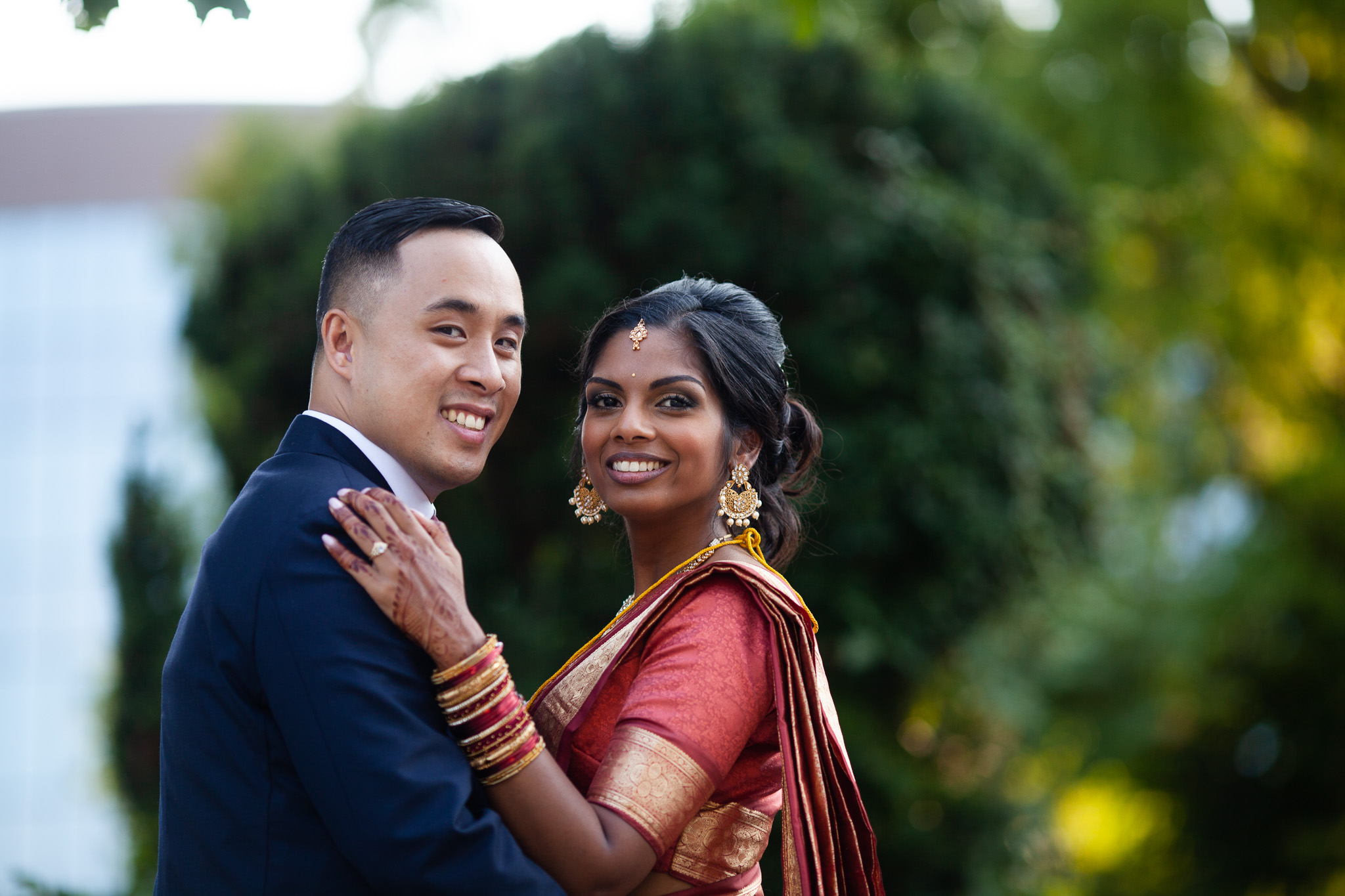 bride and groom both looking at camera and smiling.jpg