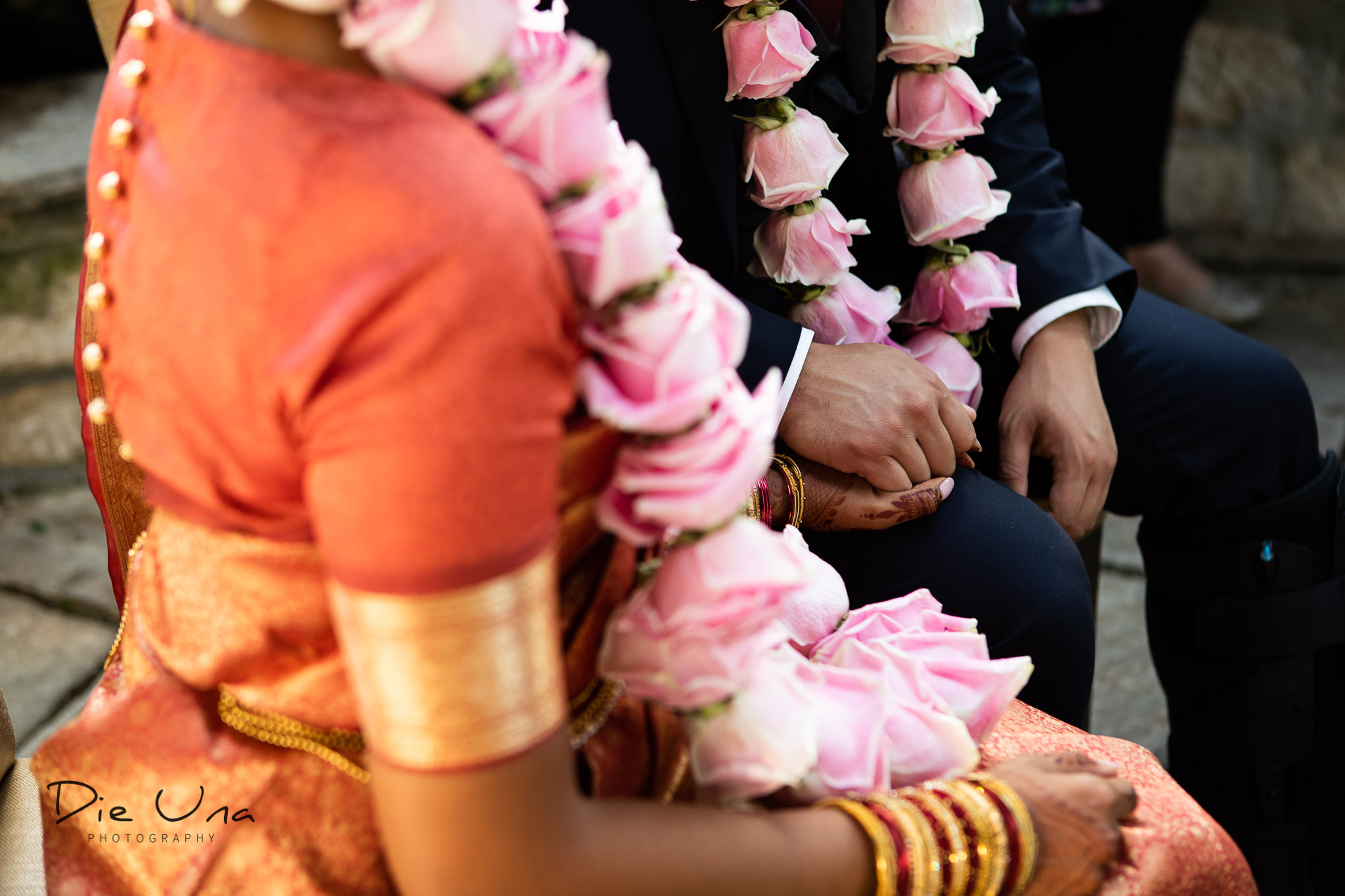 bride and groom holding hands during wedding ceremony.jpg