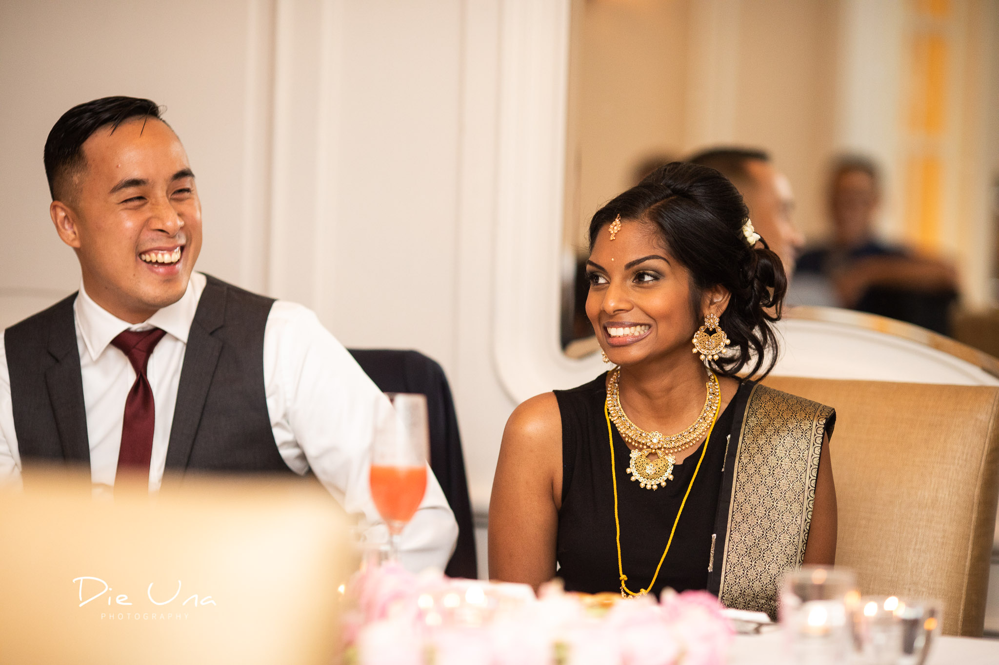 bride and groom laughing at speech.jpg