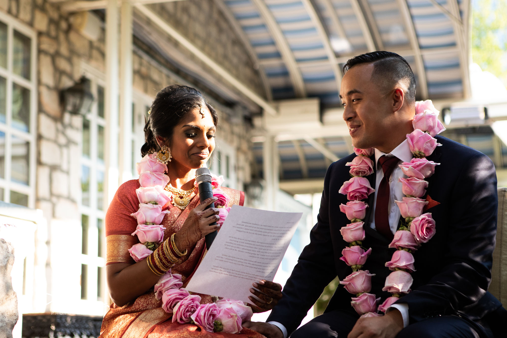 bride and groom read vows of their own making.jpg