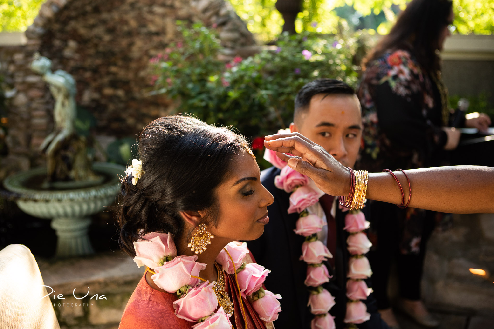 bride being blessed by mother during tying of the thaali during Hindu wedding.jpg