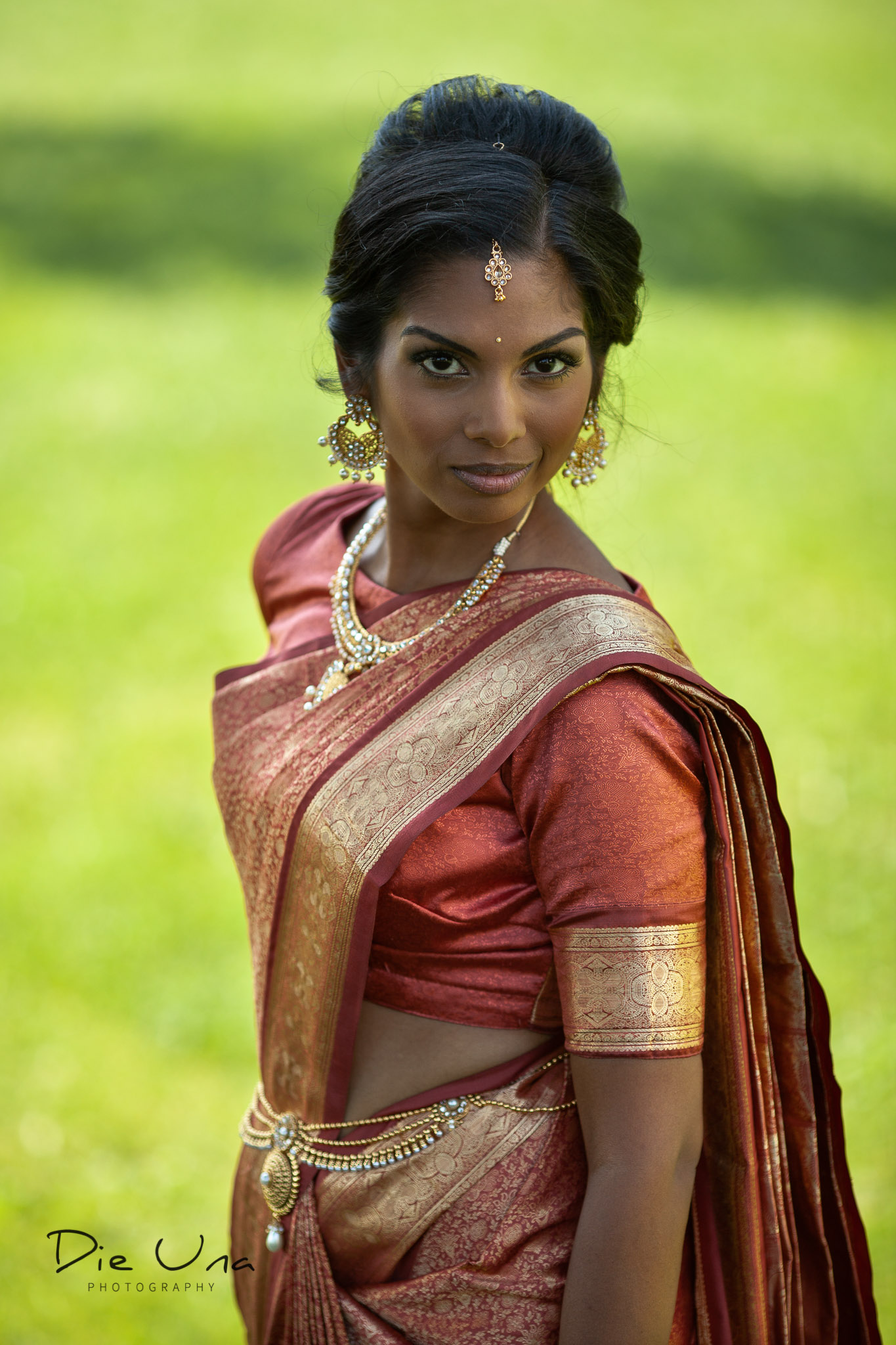 bride in saree looking at camera portrait.jpg