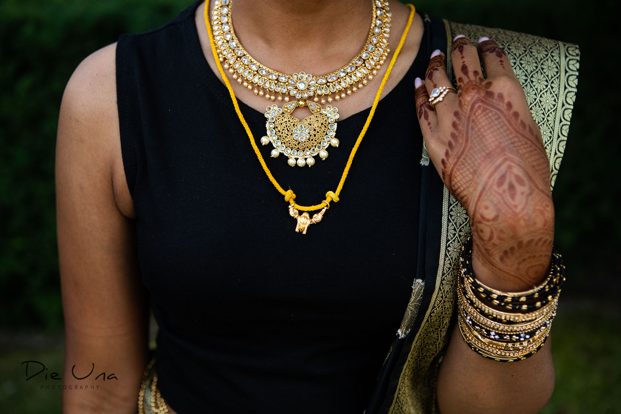 close up of bride wearing evening outfit and thaali.jpg