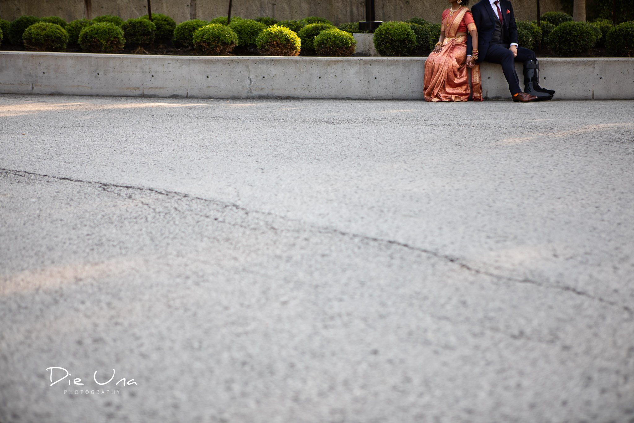 creative view of bride and groom holding hands.jpg