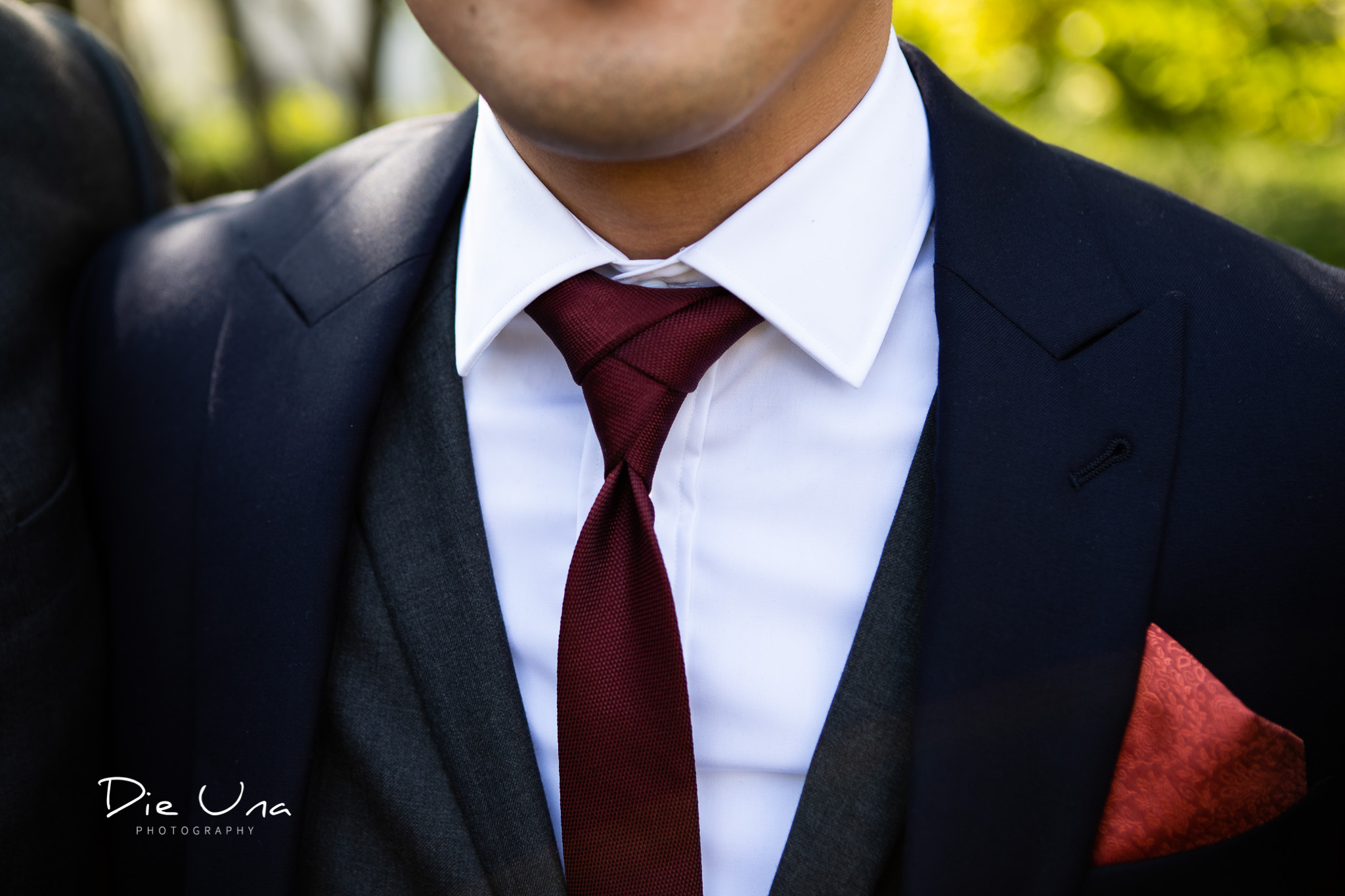 detail shot of groom with an eldredge tie knot.jpg