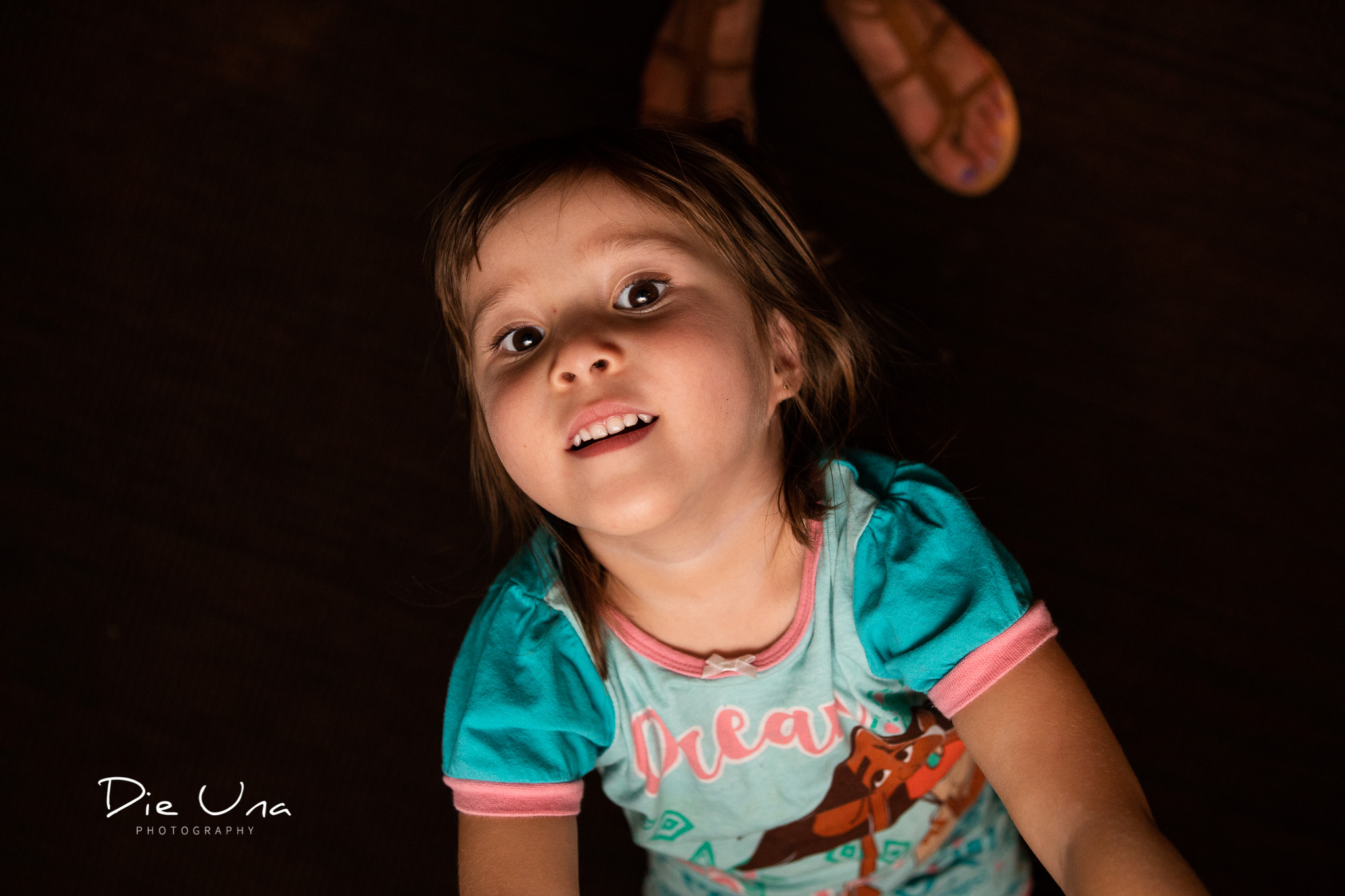 flower girl ready for bed in her pyjamas during wedding reception.jpg
