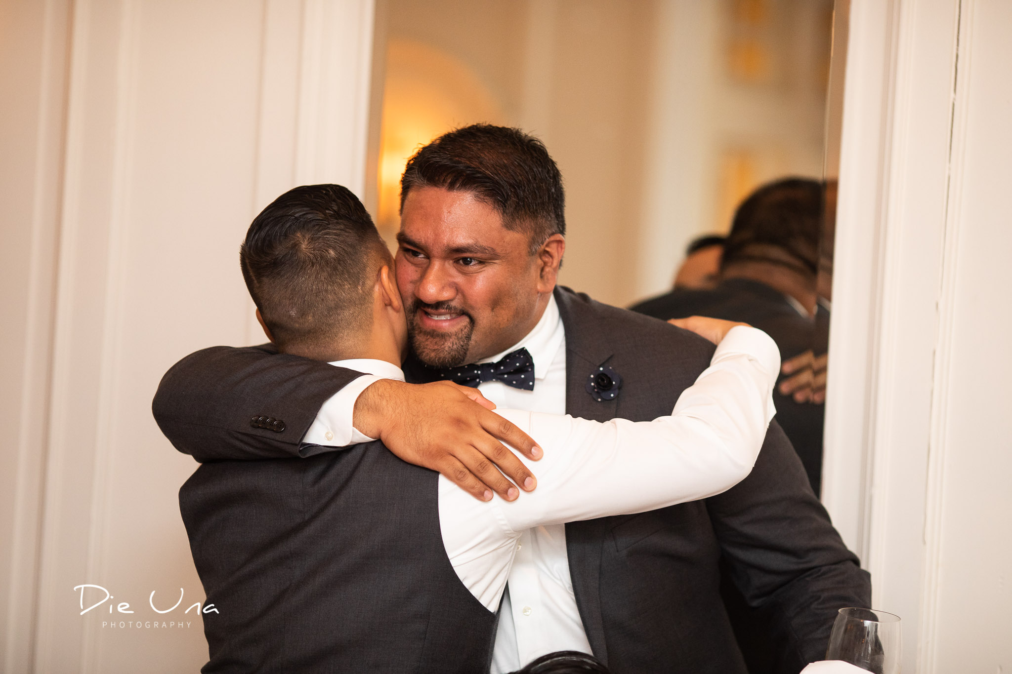 groom and bestman hugging after speech.jpg