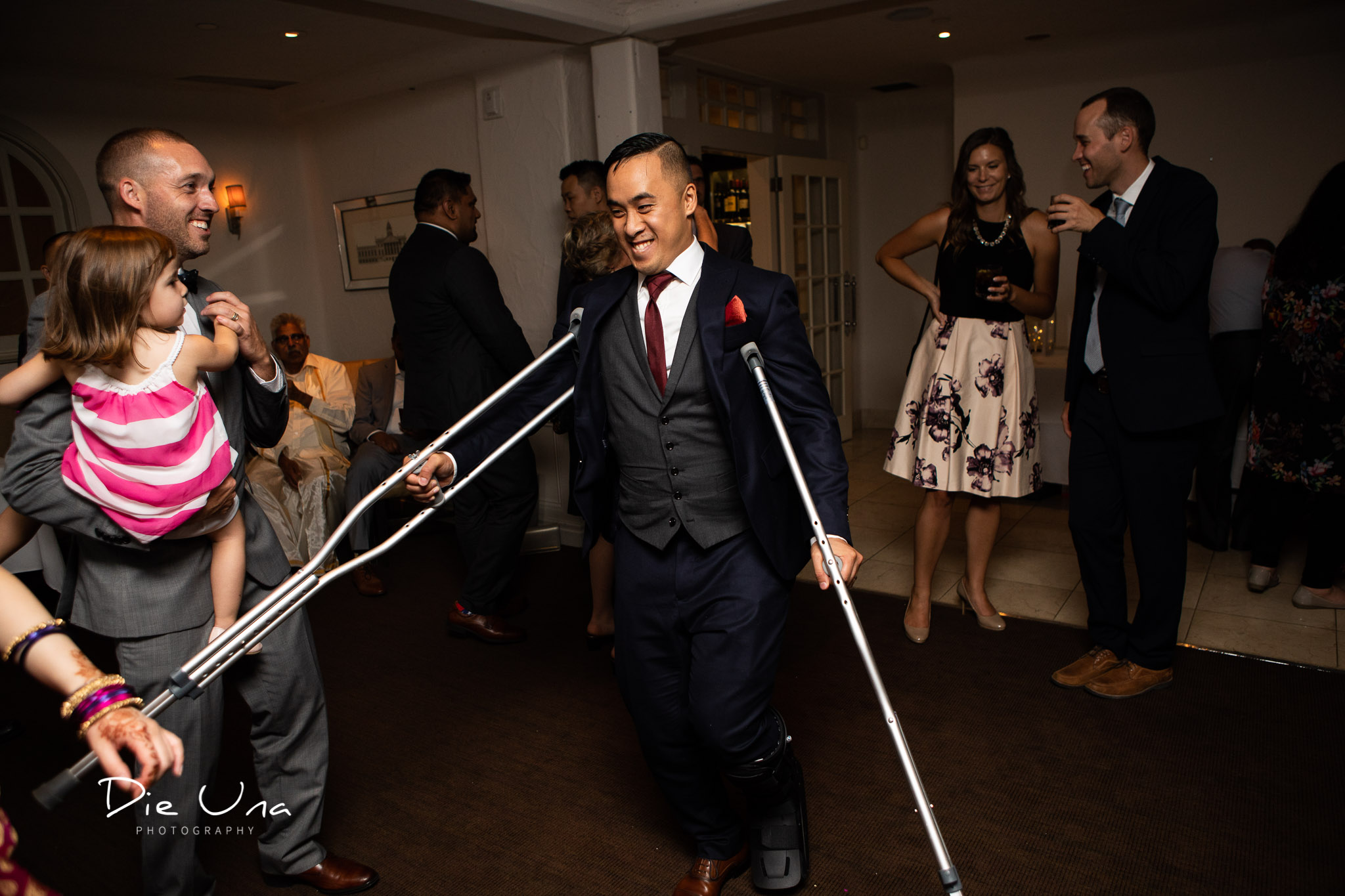 groom crutch dancing during reception.jpg