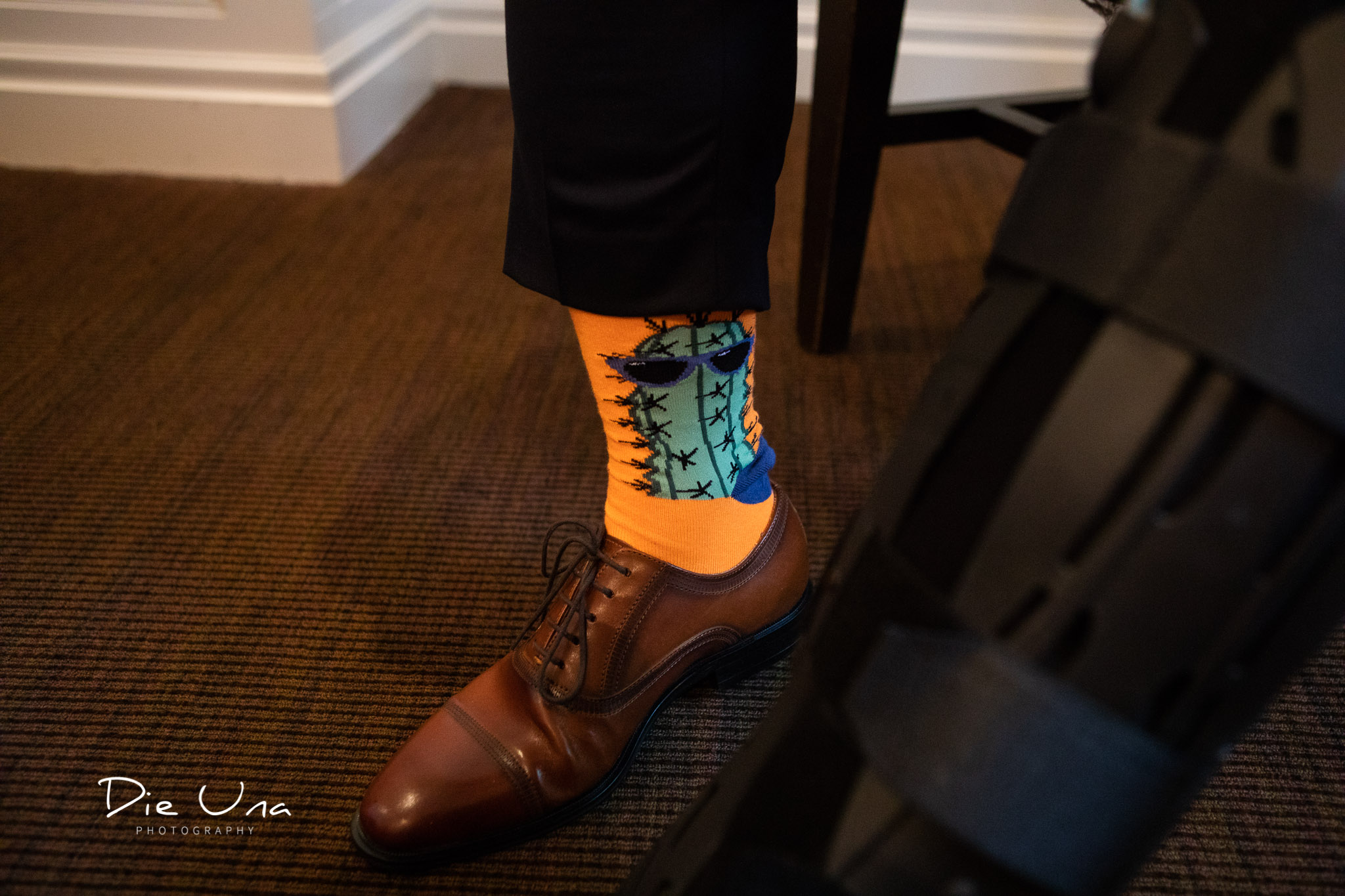 groom's fancy orange socks with a cactus on the sock.jpg