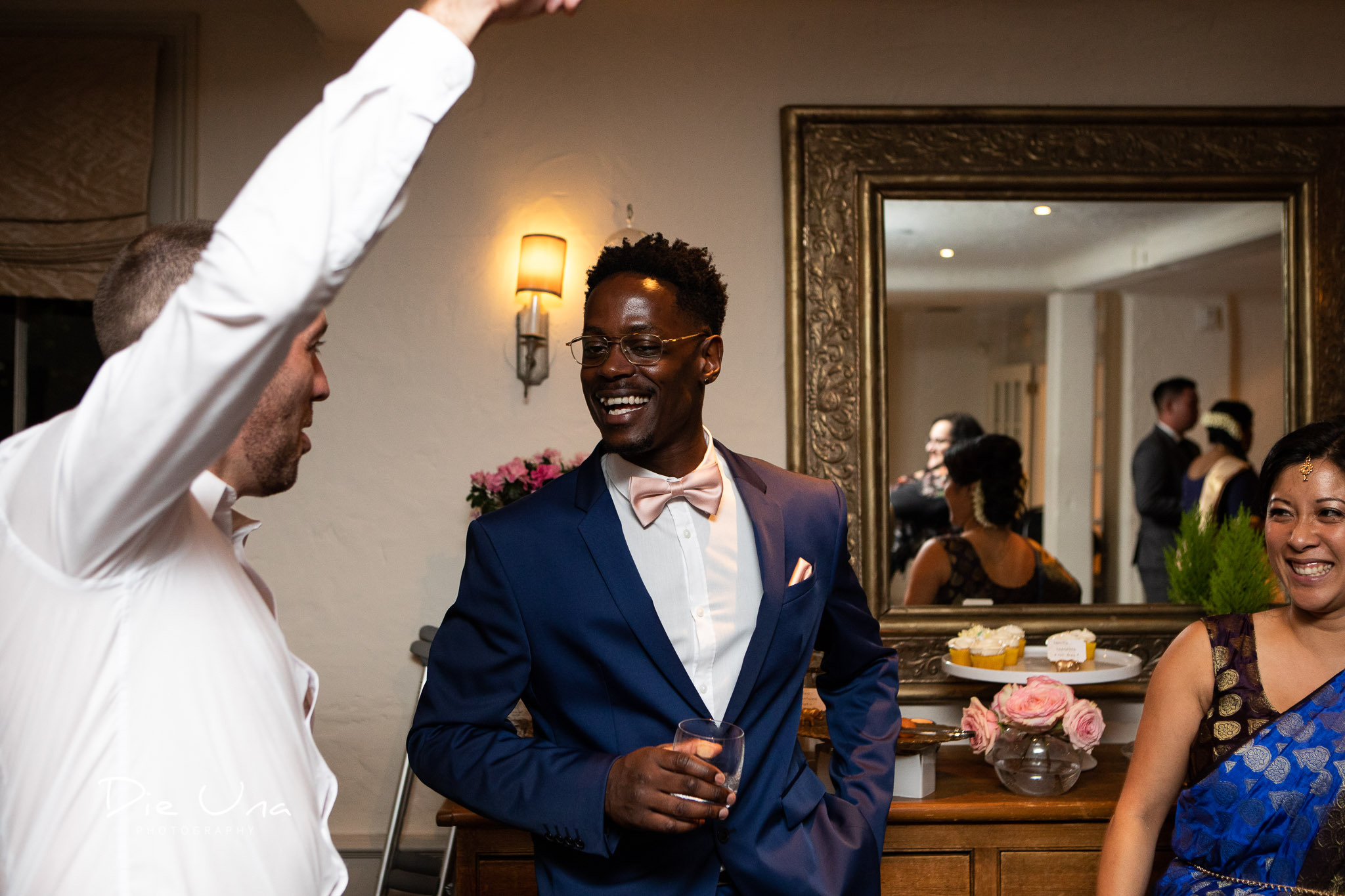 guests laughing during wedding reception.jpg