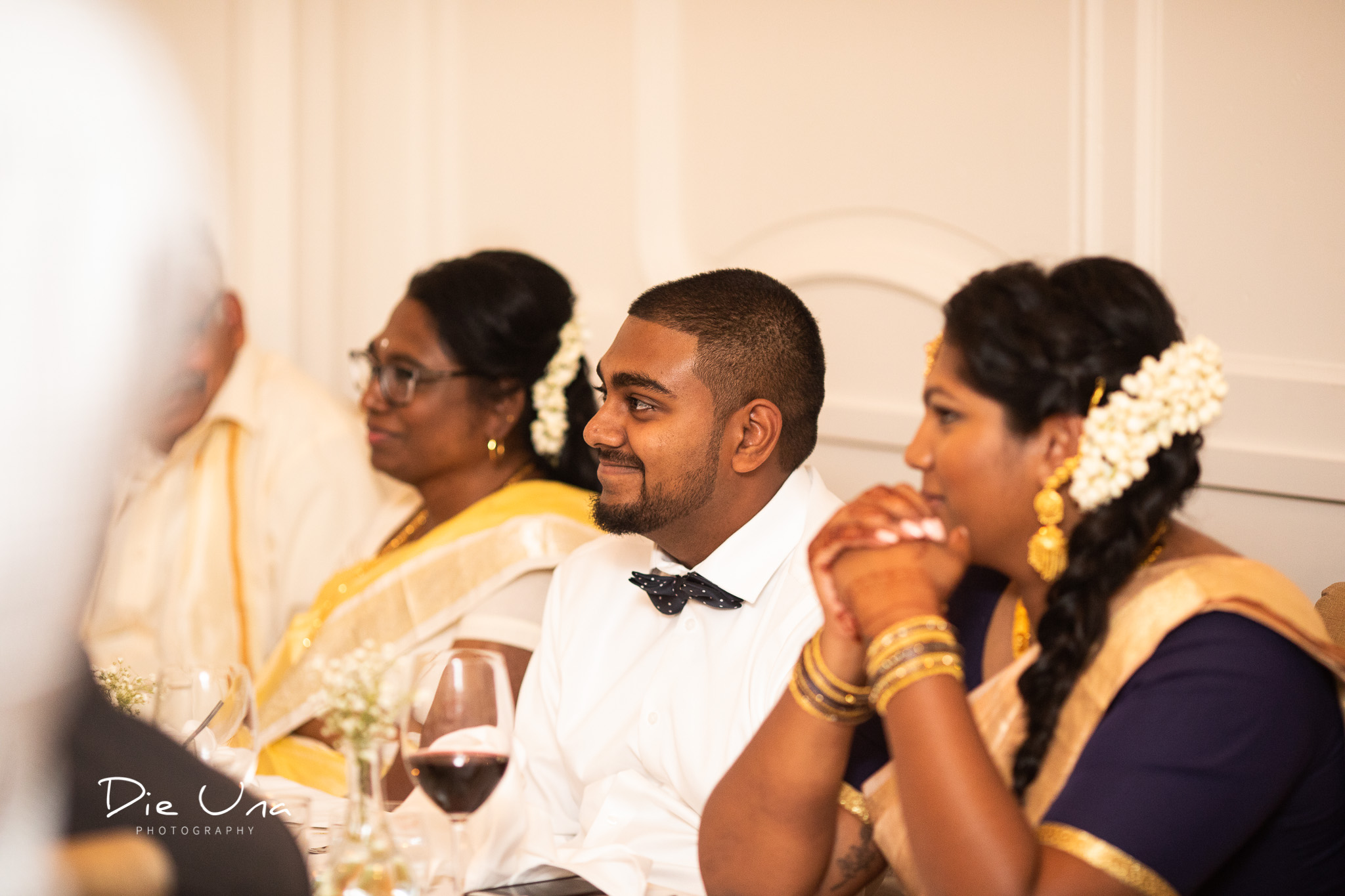 happy guests during speeches at wedding.jpg