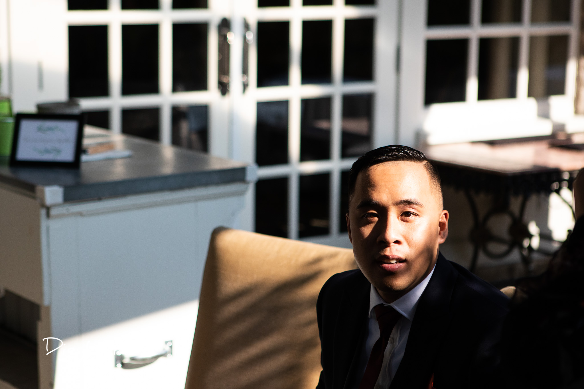 harshlight portrait of groom during ceremony.jpg