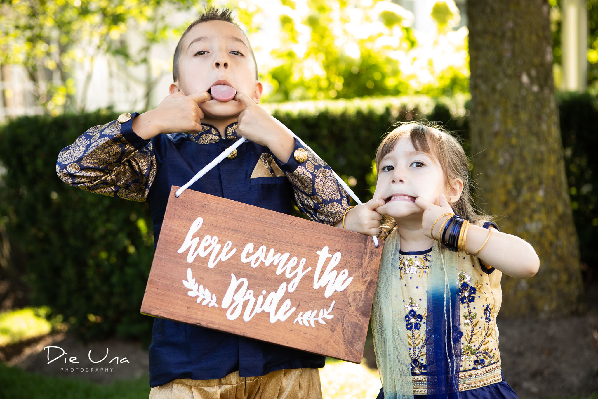 kids giving their best silly face during wedding portraits with Dieuna photography.jpg