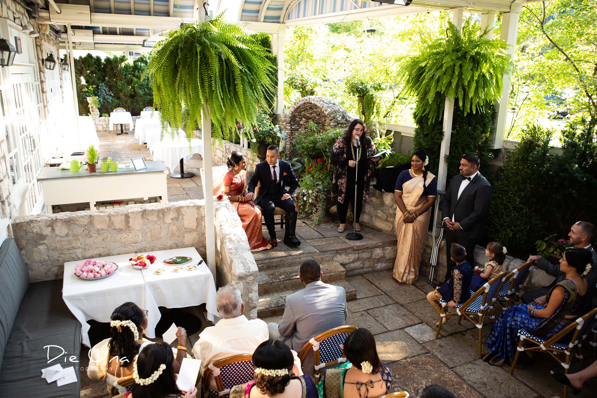 view of the terrace at Auberge du Pommier with all wedding guests.jpg
