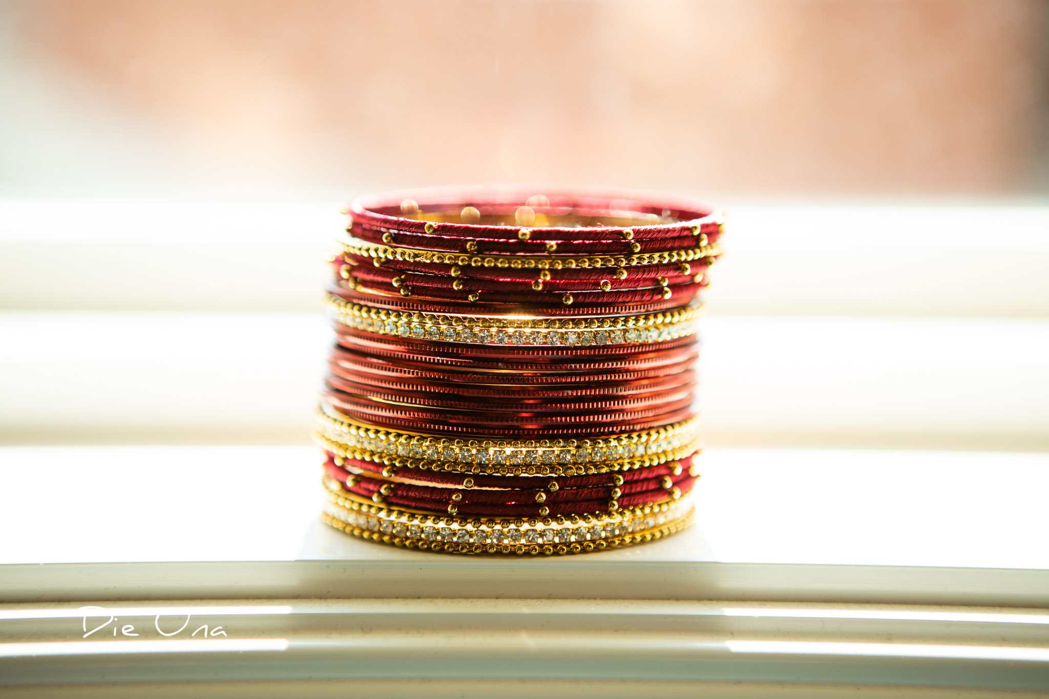 wedding bracelets stacked up in window.jpg