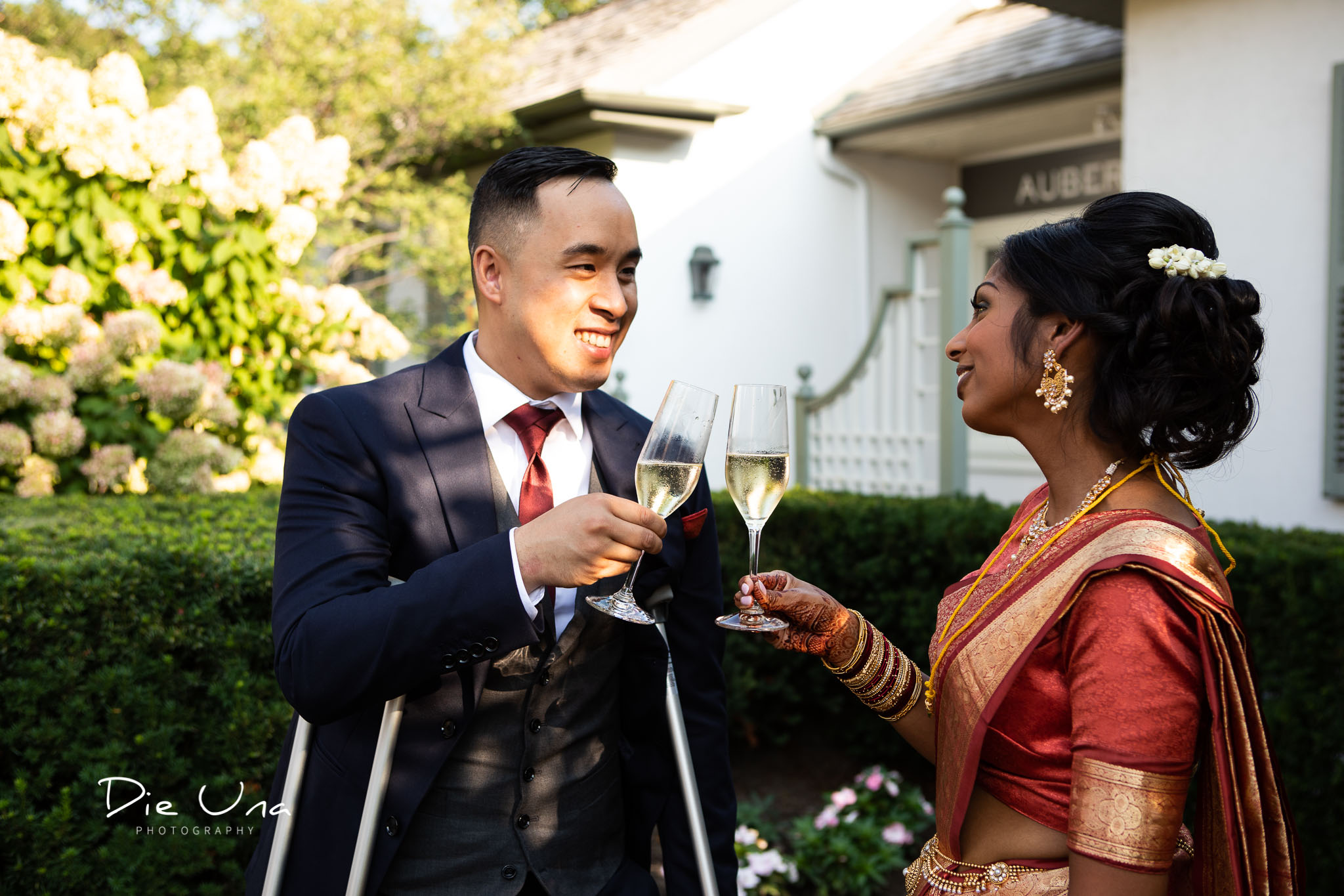 wedding cheers between bride and groom with champagne.jpg