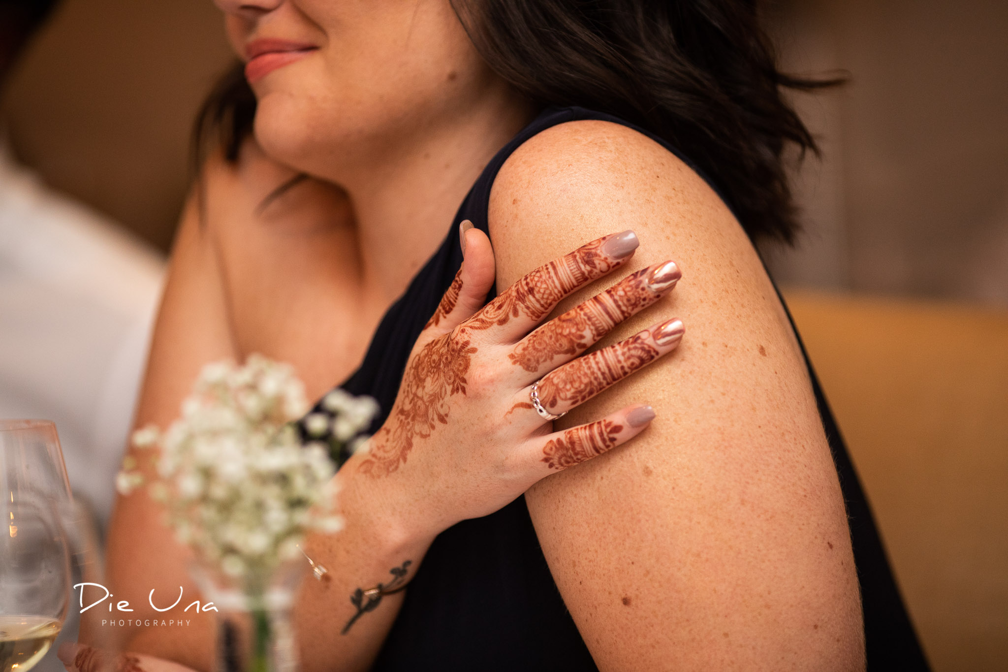 wedding guest moment captured with henna tattooed hand.jpg