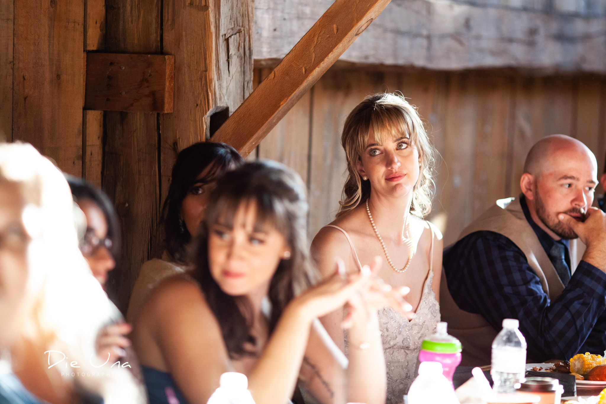 bride reacting to father during his wedding speech during barn wedding kitchener wedding photographer.jpg