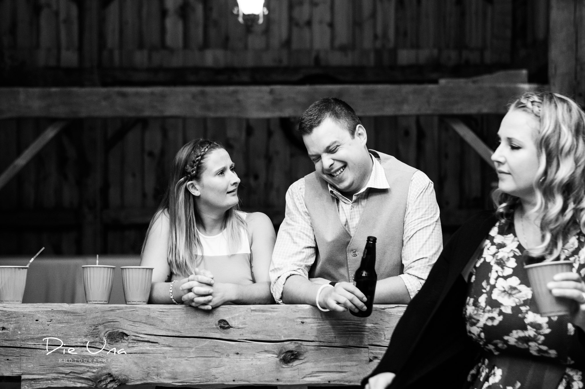 candid moment between two guests during wedding reception.jpg
