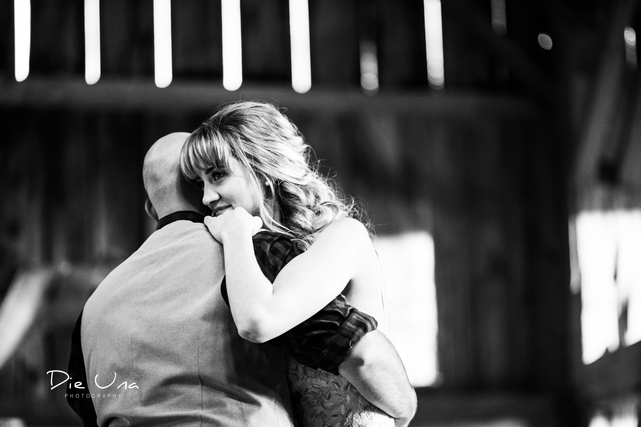 first dance with bride and groom in barn black and white kitchener photography.jpg