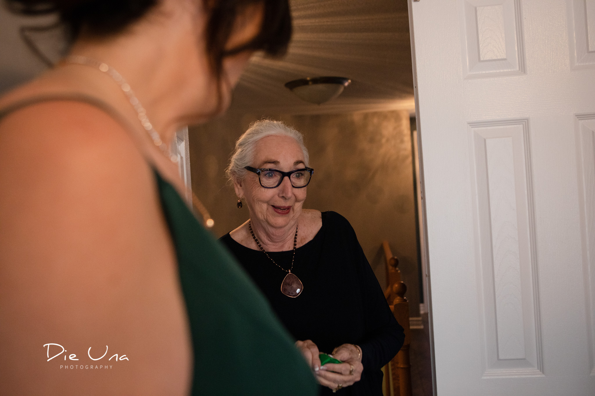 grandmother getting a first look of bride in her wedding dress.jpg