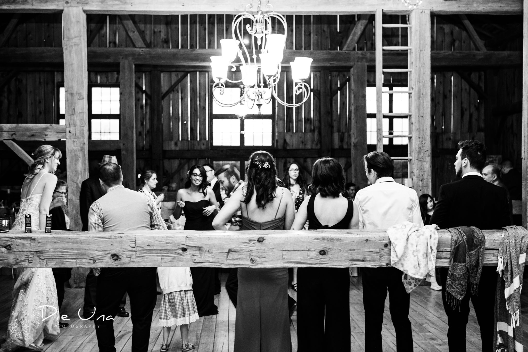 wedding guests standing back and watching the dancing black and white wedding photography.jpg