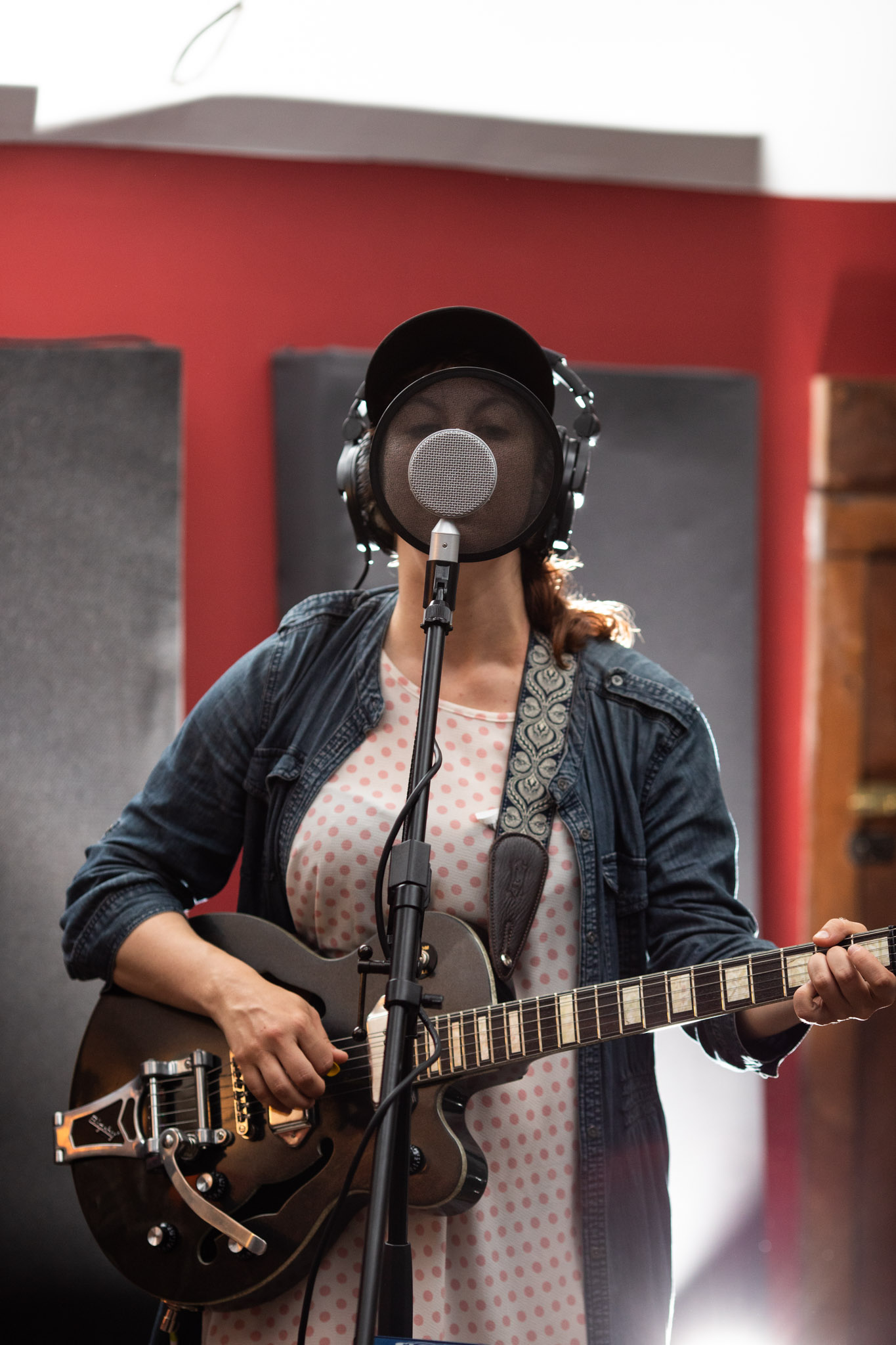 Alison playing guitar and singing at Frederick House Audio.jpg