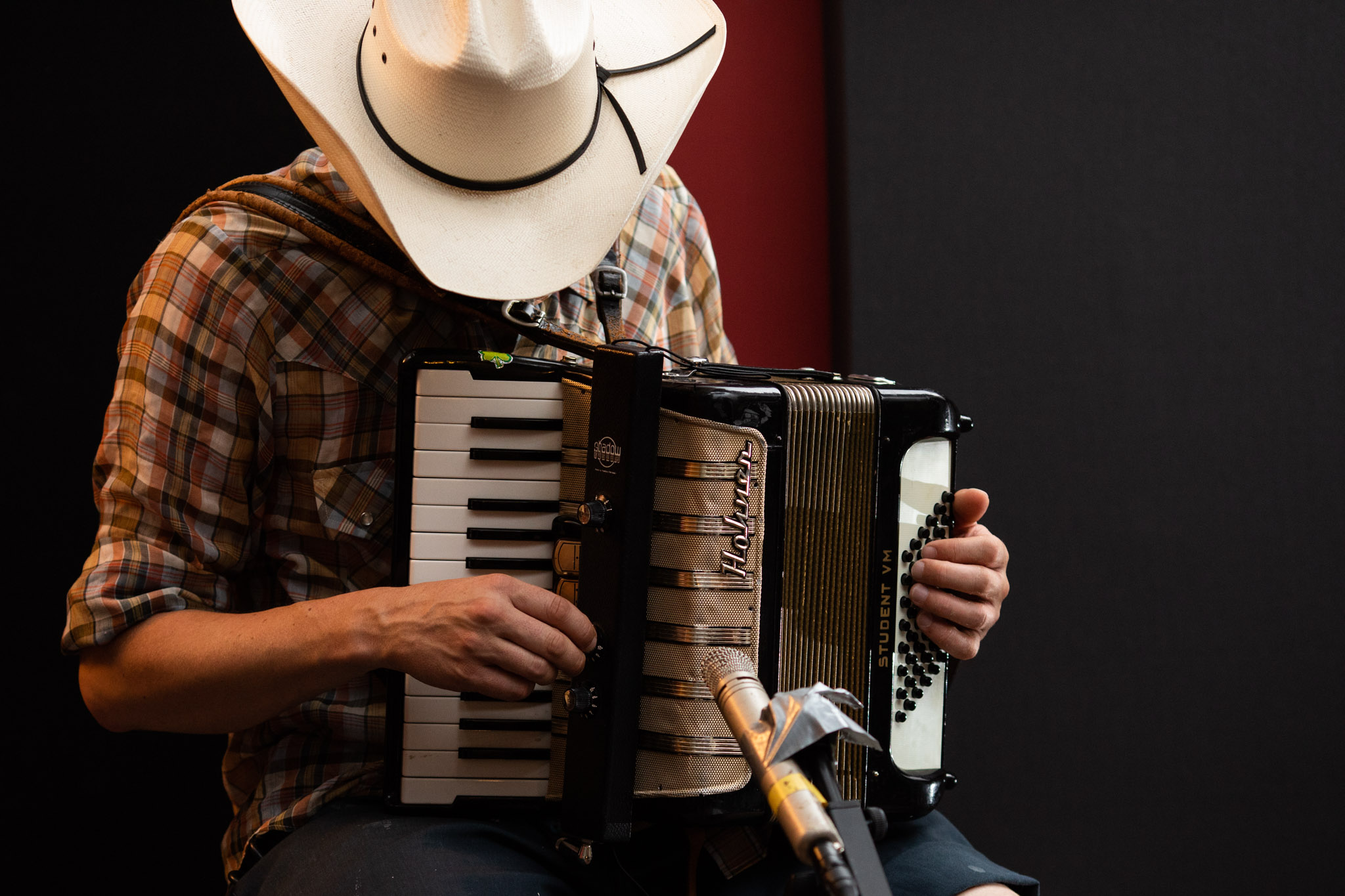 musician wearing cowboy hat playing accordion at frederick house audio.jpg