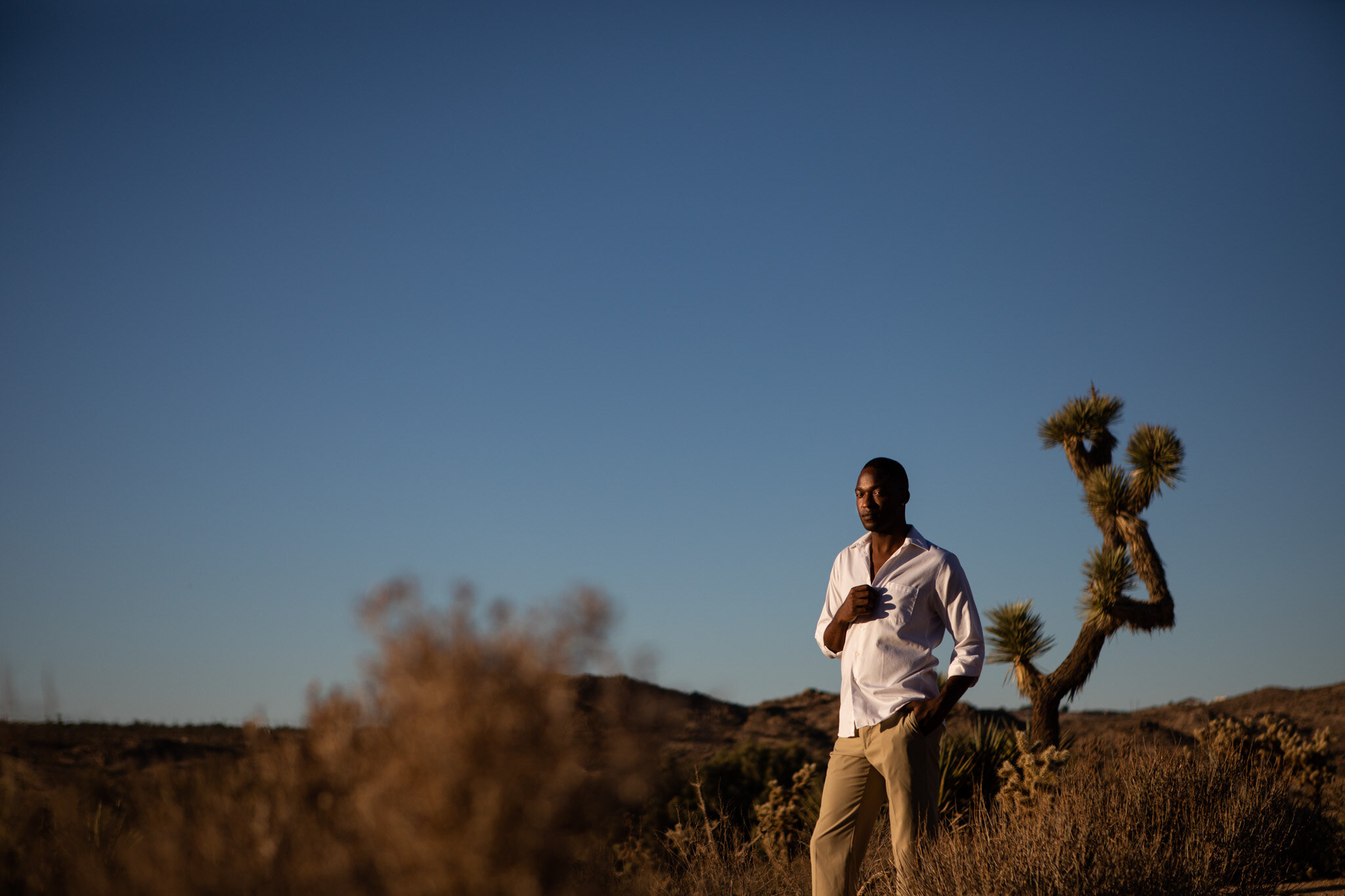 harsh sunlight striking model Jamal Pitts in the Joshua Tree desert during the PPC 2018.jpg