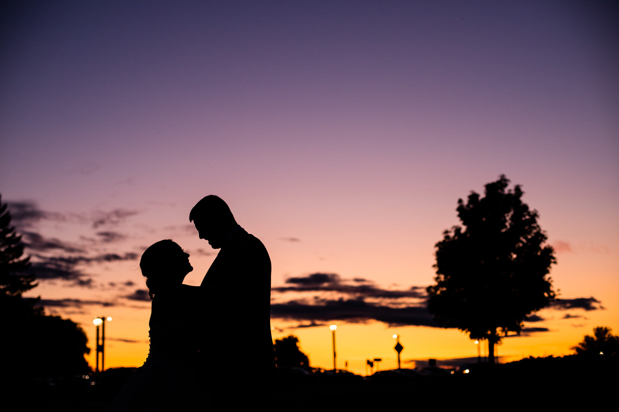 bride and groom silhouette with sunrise at NAV Canada Centre.jpg