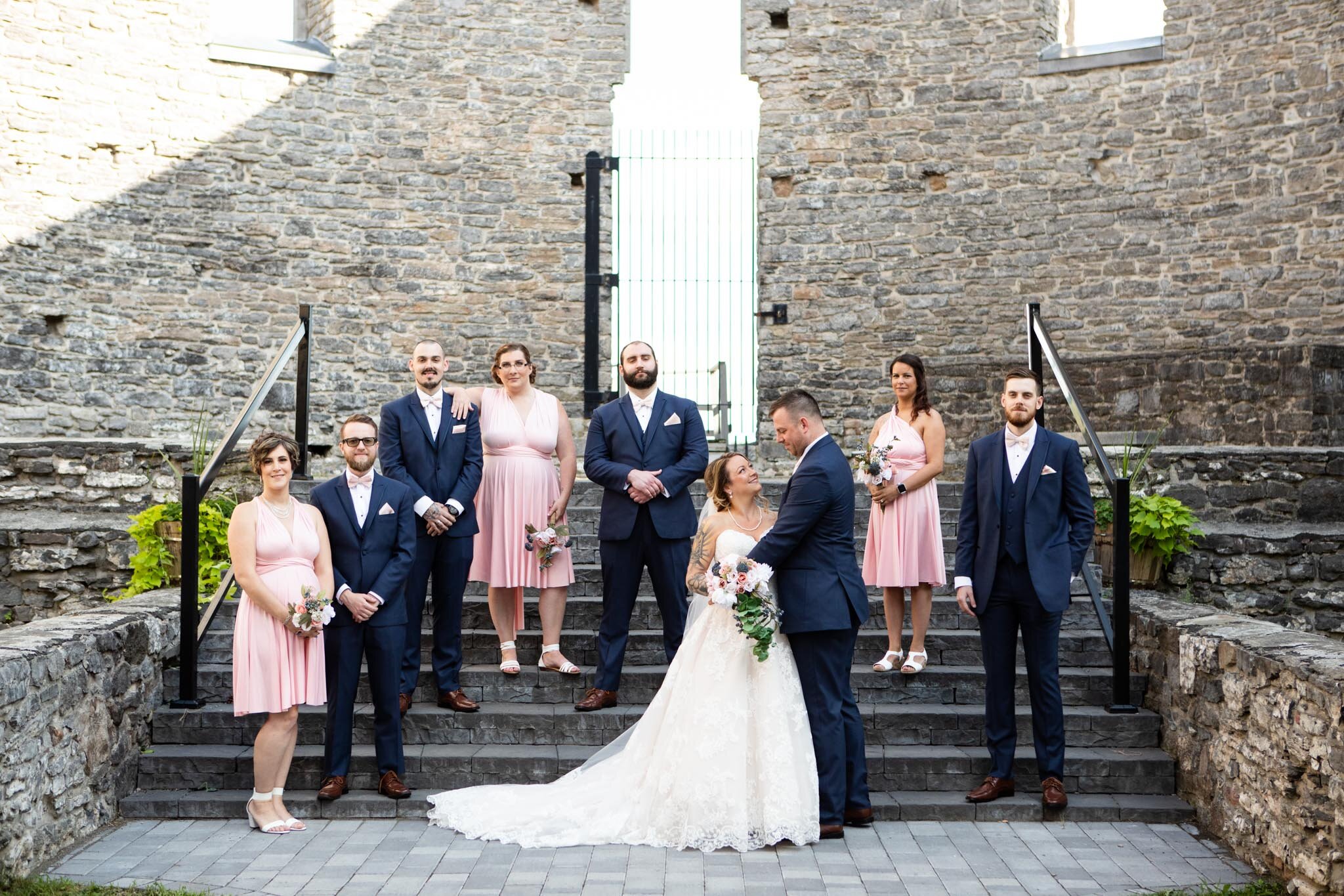 entire wedding party on the steps inside St Raphael's Ruins.jpg