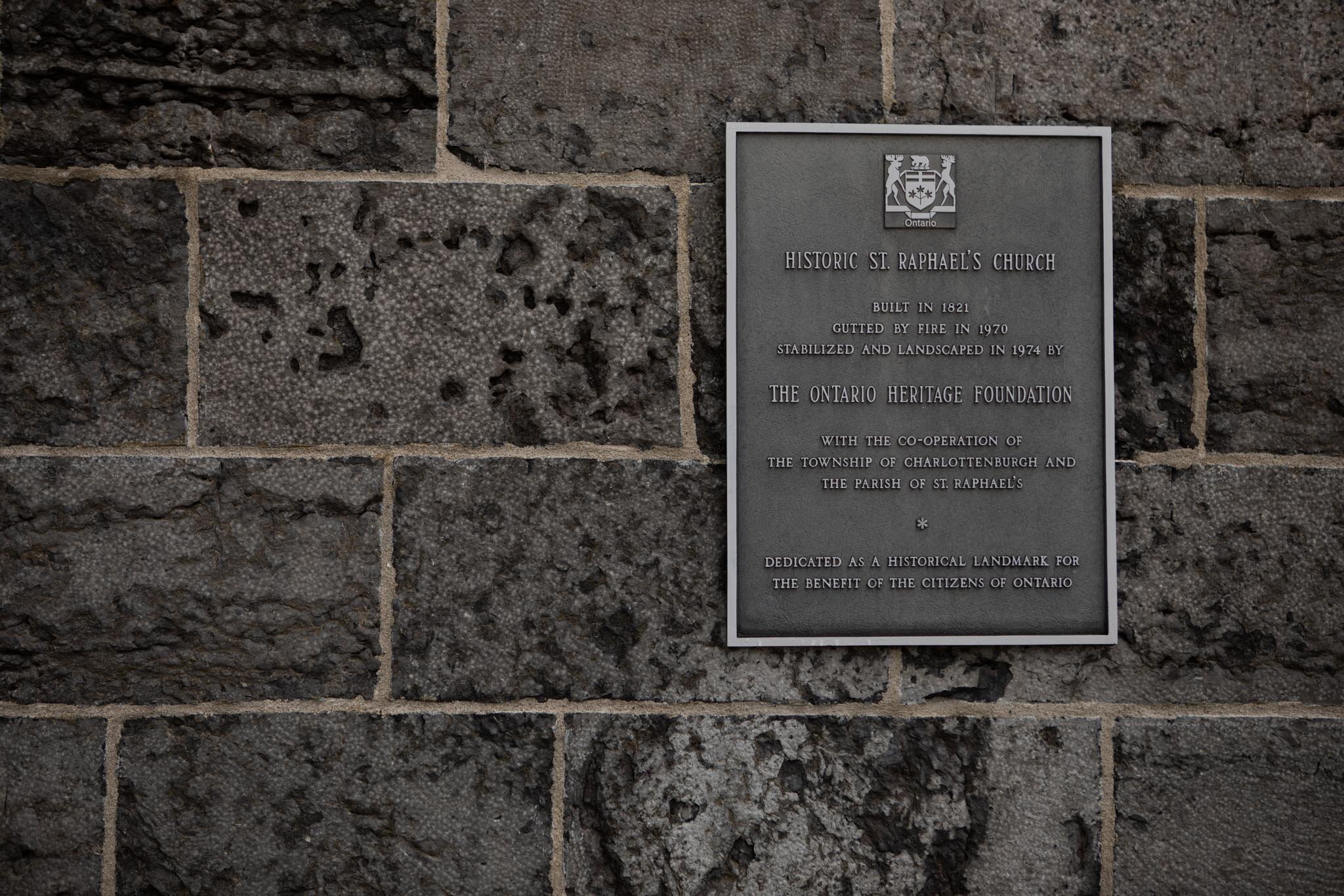 historic plaque with information about St Raphael's ruins.jpg