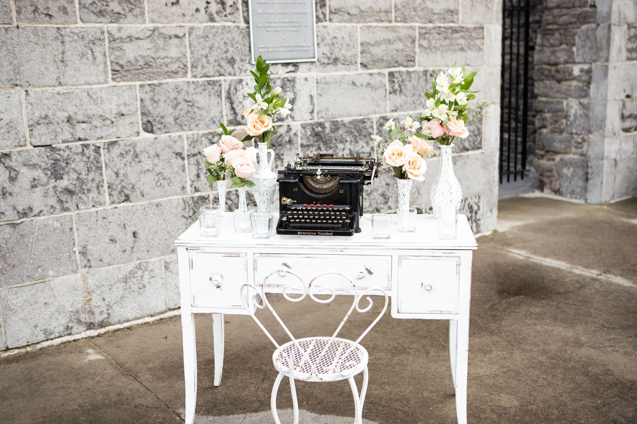 typewriter and desk wedding decorations at St Raphael's ruins.jpg