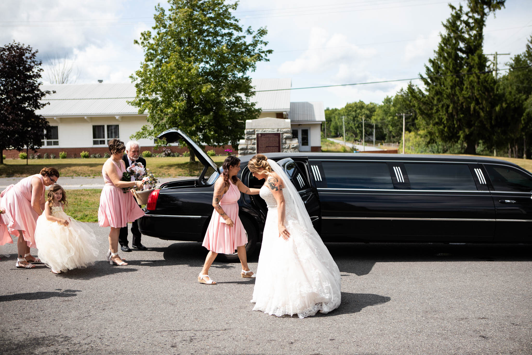 wedding party showing up at St Raphael's Ruins in a black limo.jpg